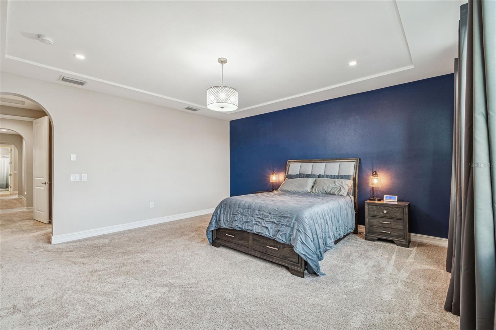 Spacious primary bedroom with expansive walk-in closet