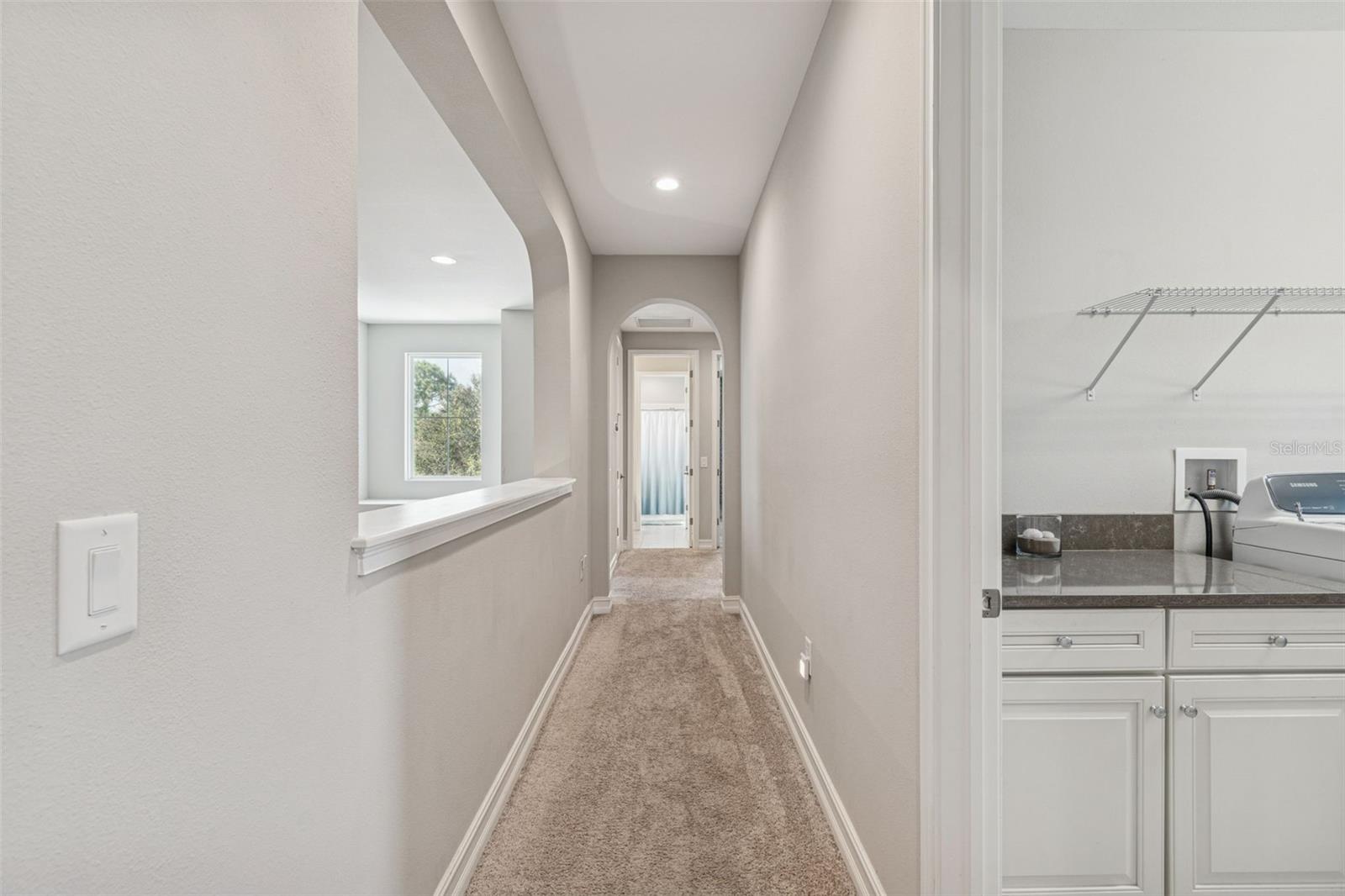 Hallway leading to upper level laundry room