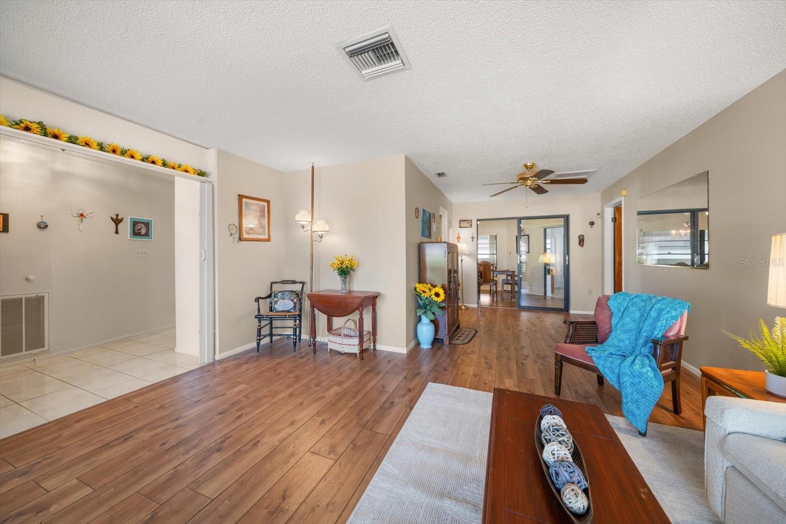 The living room is full of natural light