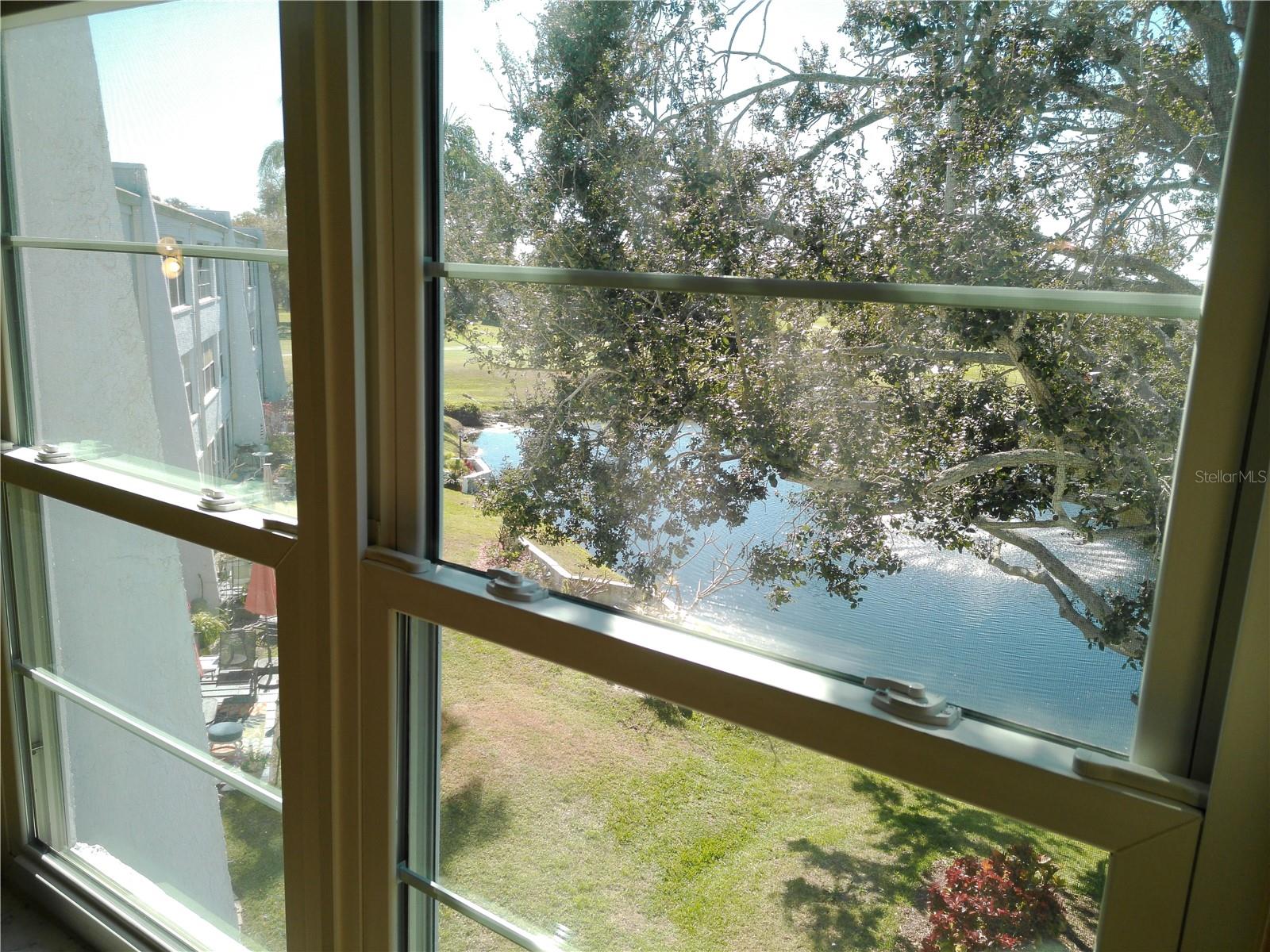 This unit has newer windows and an awesome view of courtyard area with pond and fountain that lights up at night