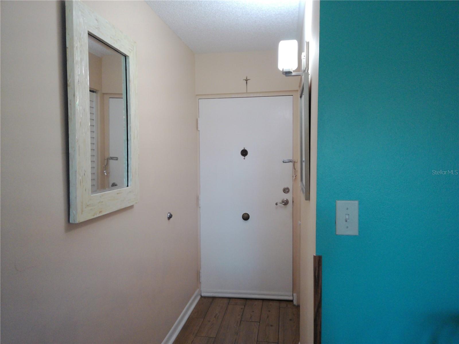 Hallway to door out of your beautiful Condo