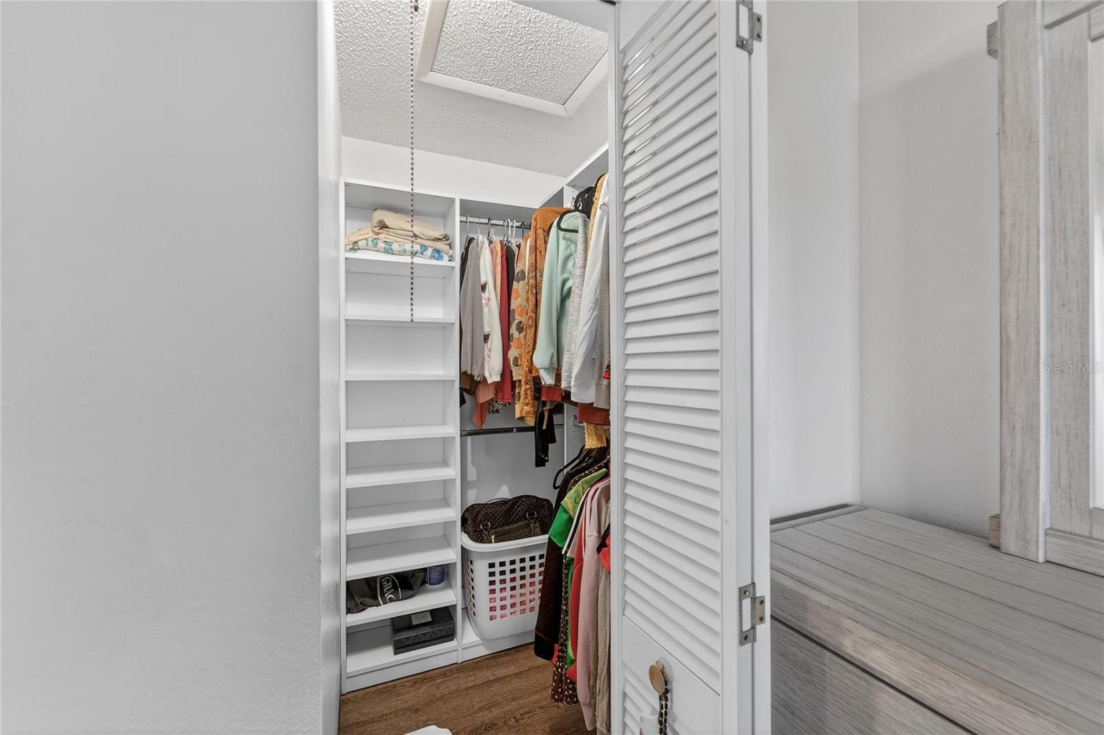 A fantastic use of space0your walk-in closet with custom organization system