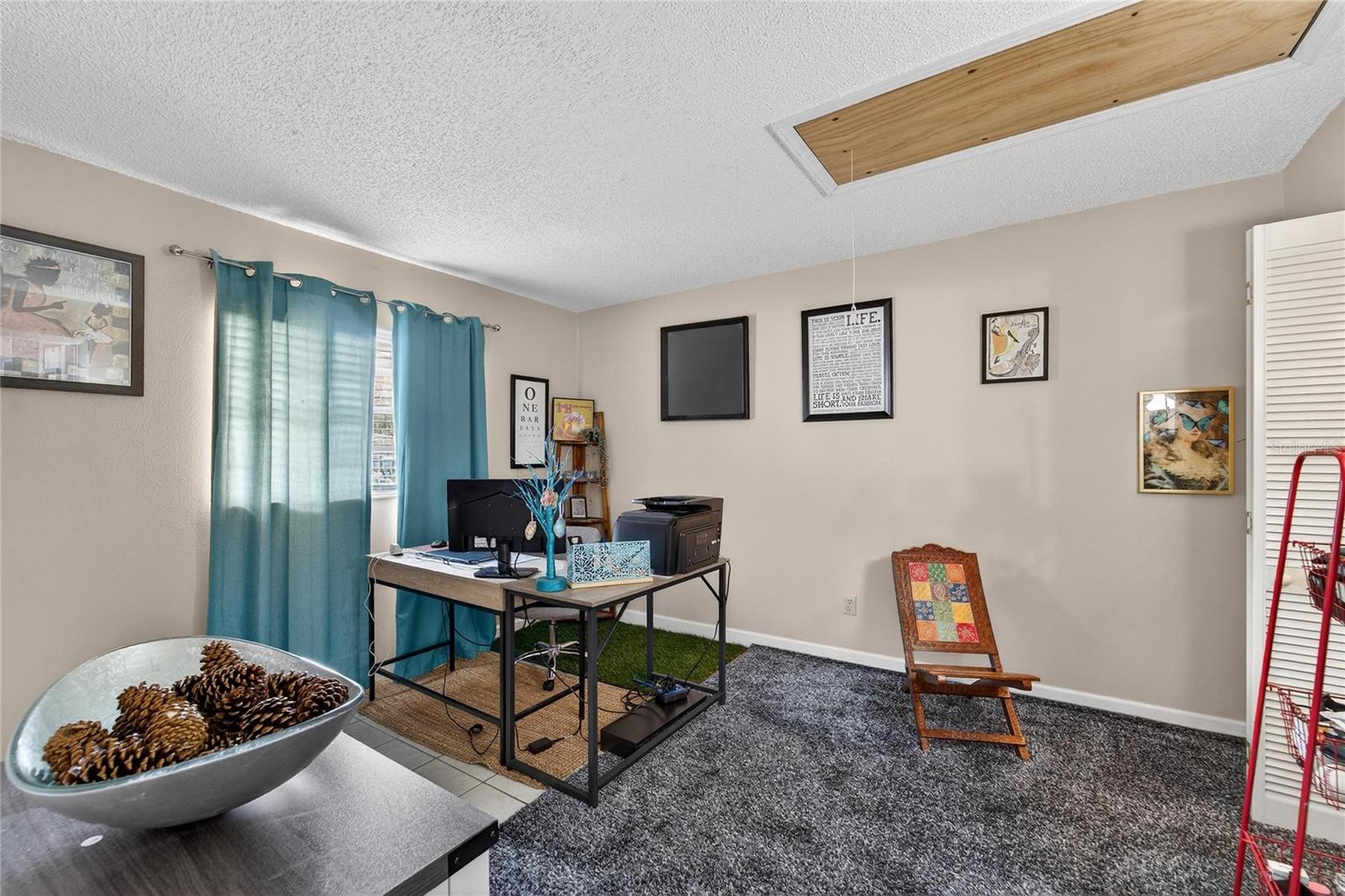 Your spacious second bedroom with attic access for additional storage.