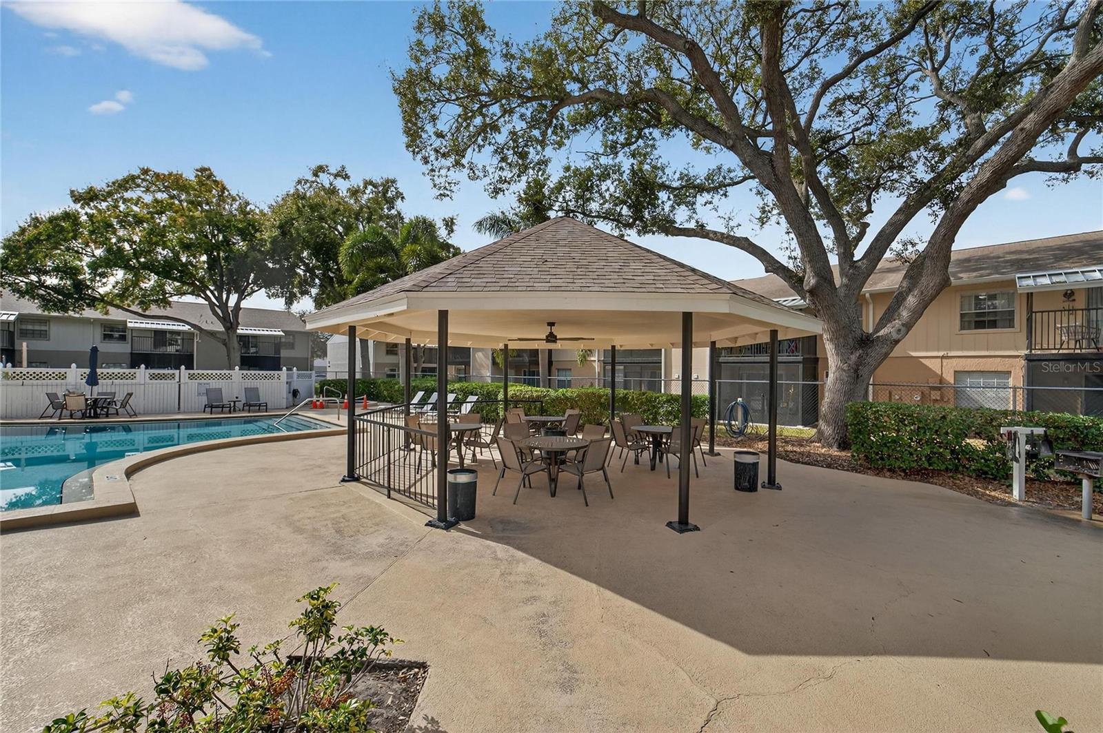 The gazebo is the perfect spot for a poolside lunch or refreshing drink to cool down