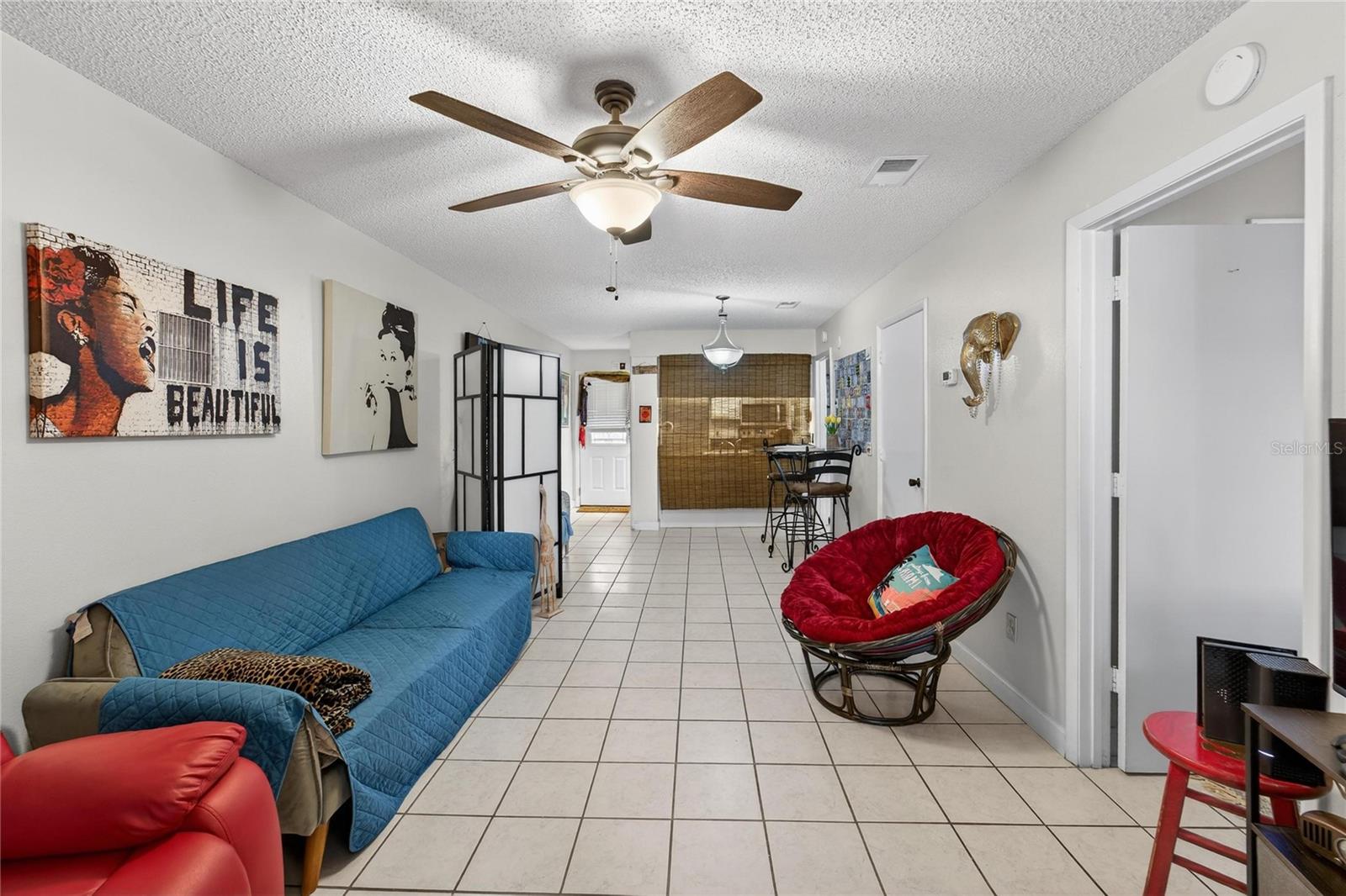 Looking towards front door and dining room as we walk into kitchen