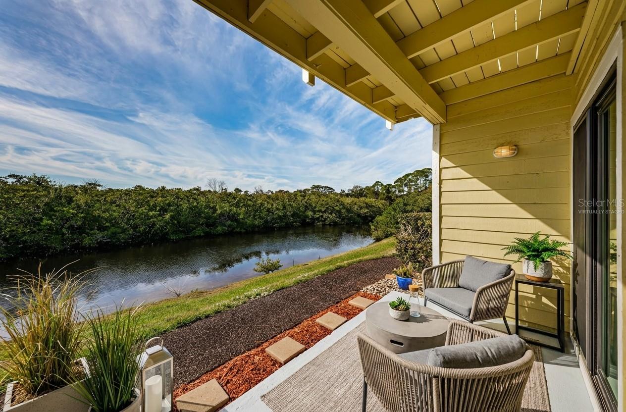 Porch with view of the pond - virtually staged