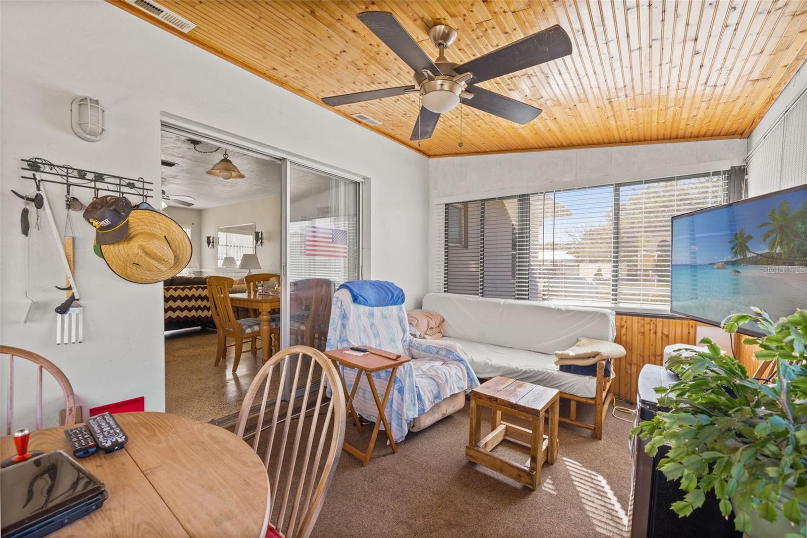 covered and enclosed back porch/lanai