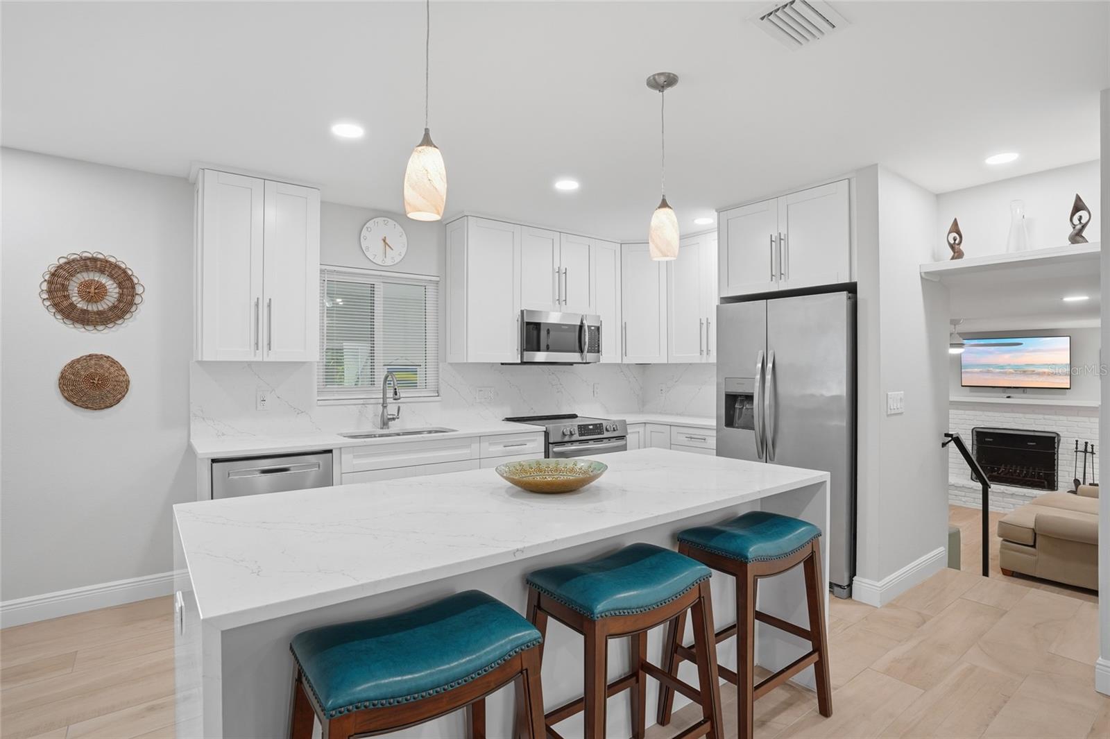 Kitchen with quartz countertops and new appliances