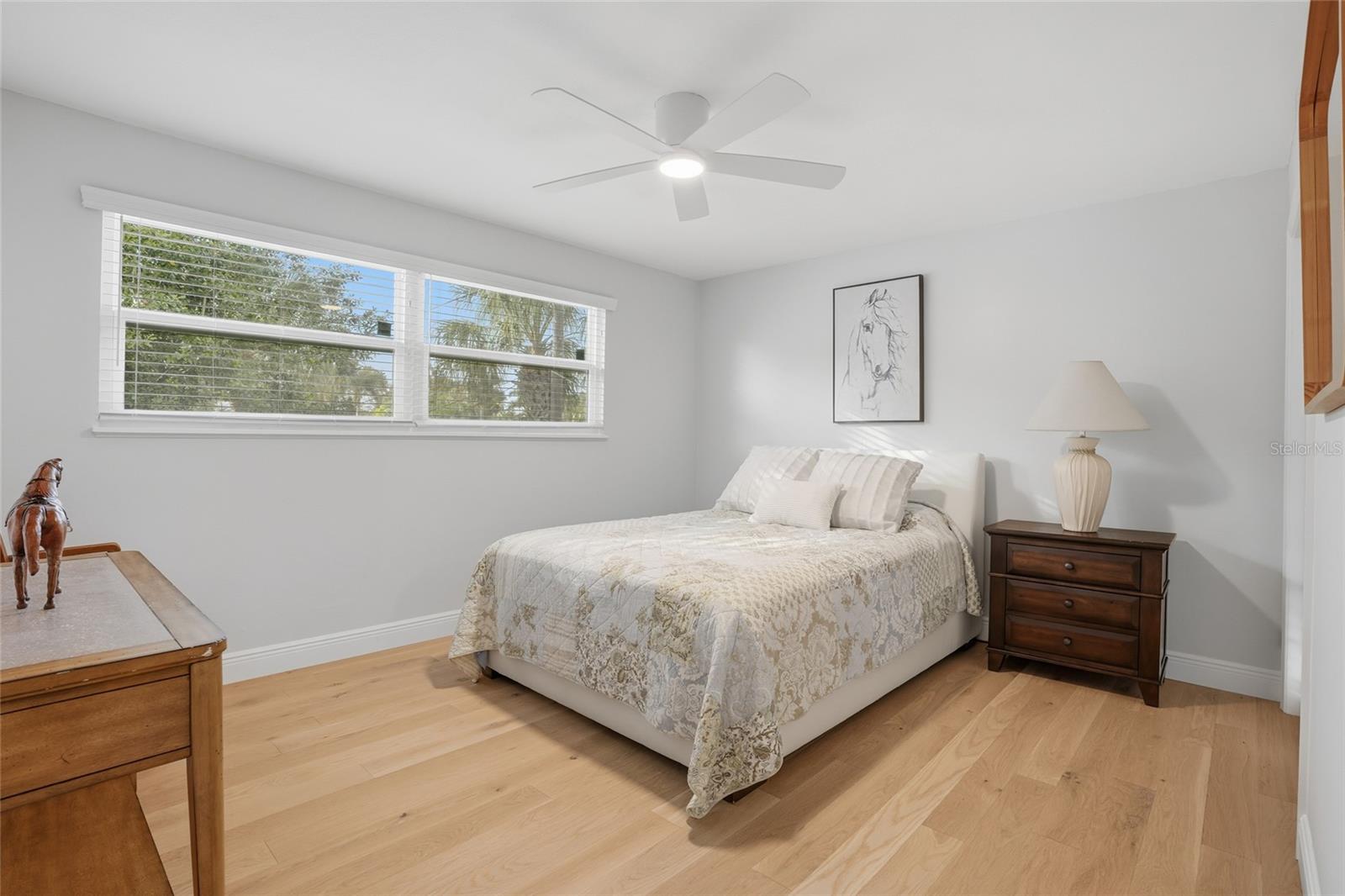 Guest room with wood floors
