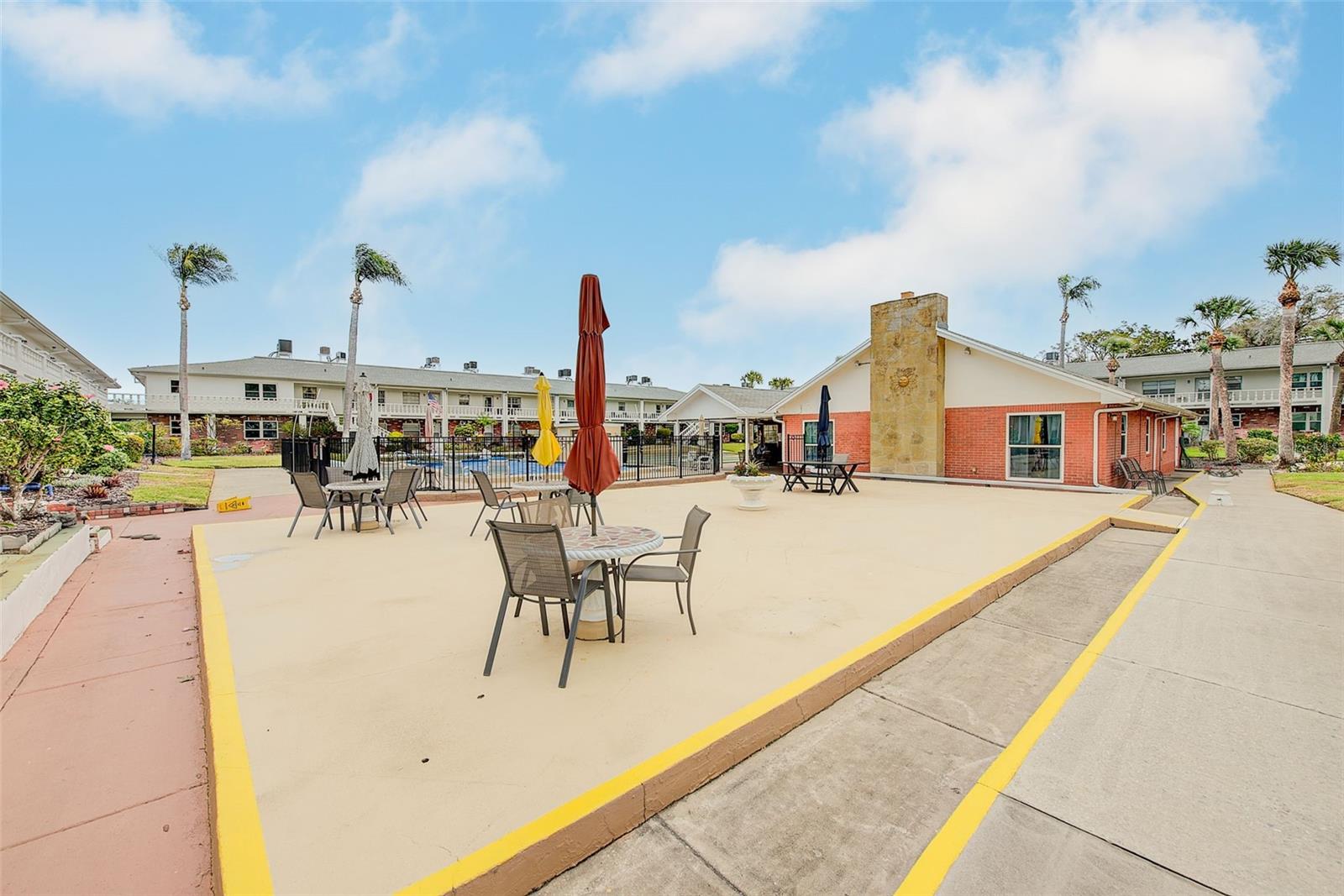 View of patio with table and chairs