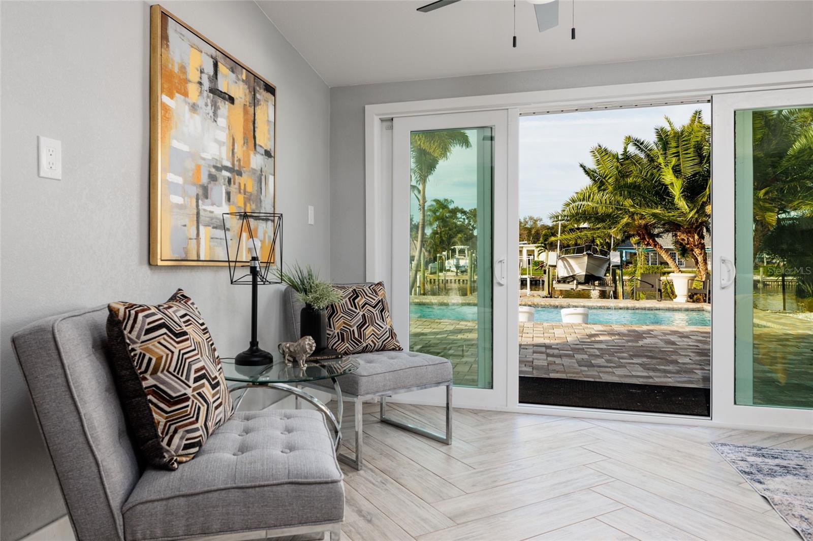 Living Room with Water and Pool View
