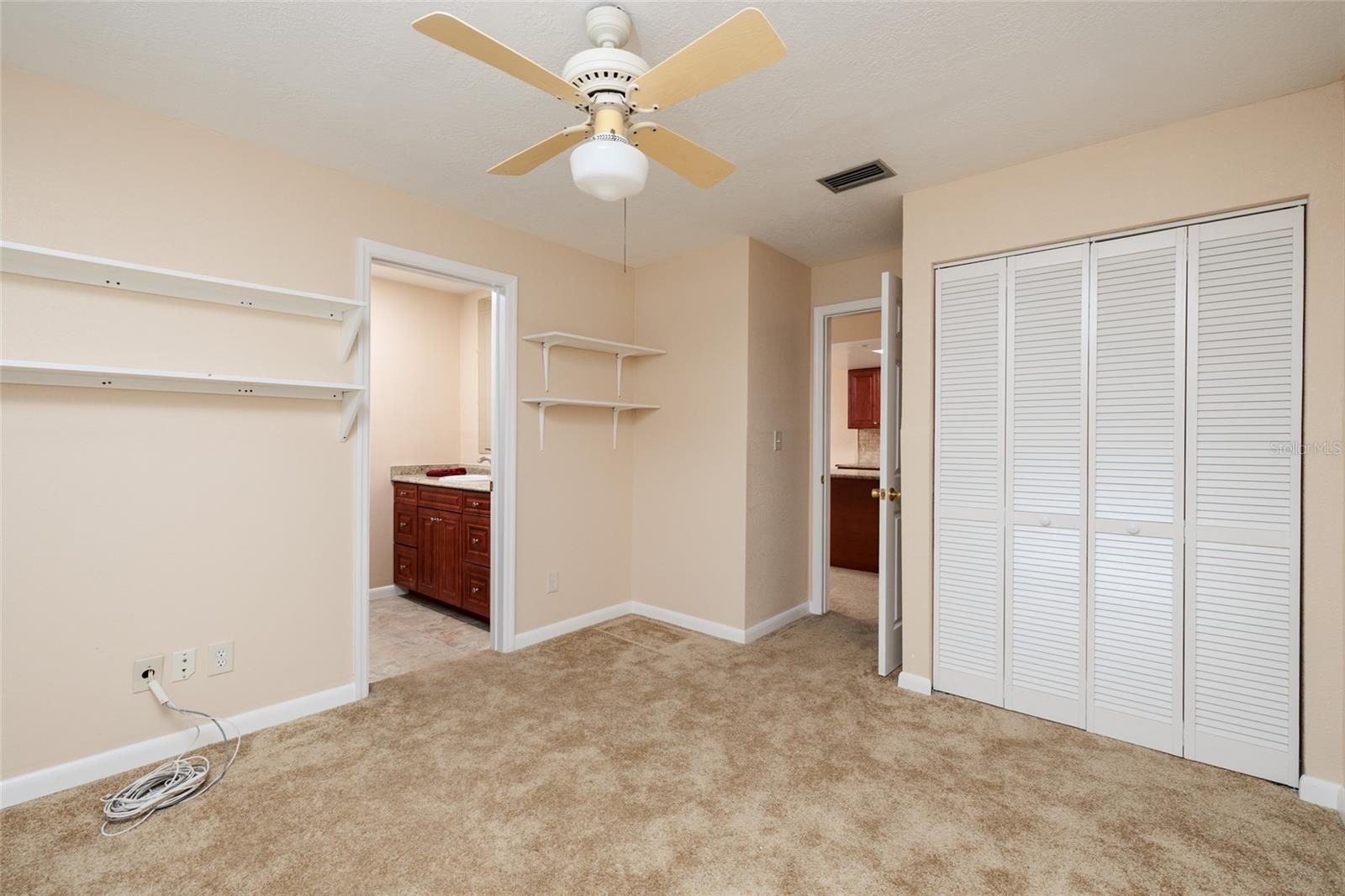 Bedroom 2 with access to hall to kitchen and bath