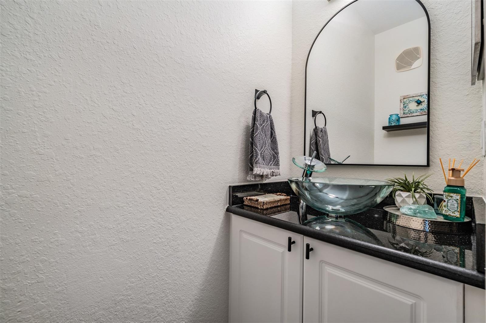 Powder bath downstairs, acorss from stairs