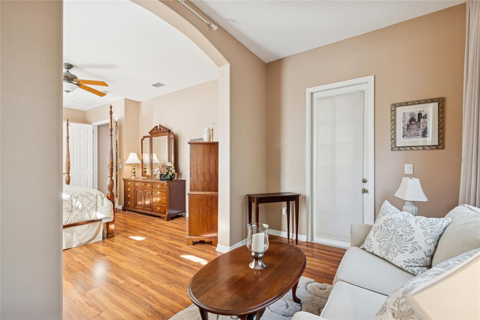 OWNER'S RETREAT SITTING AREA WITH VIEW OF BEDROOM