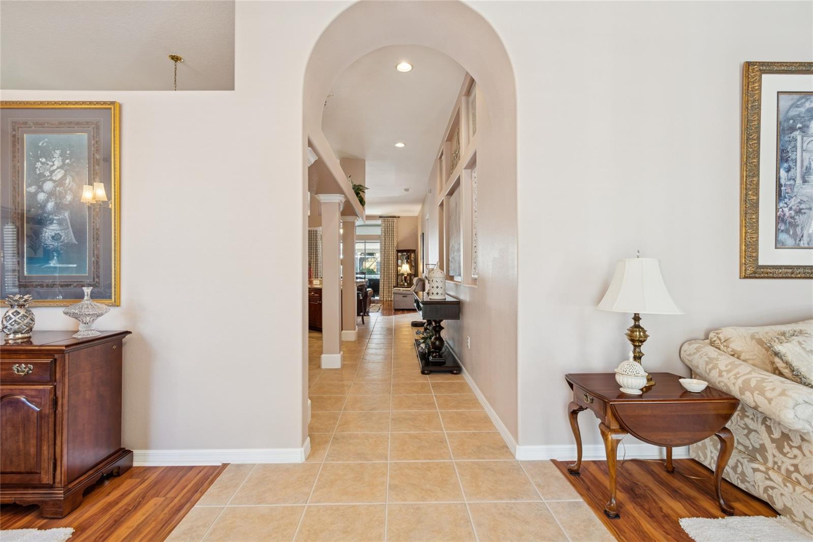 FOYER AND HALLWAY TO KITCHEN AND FAMILY ROOM