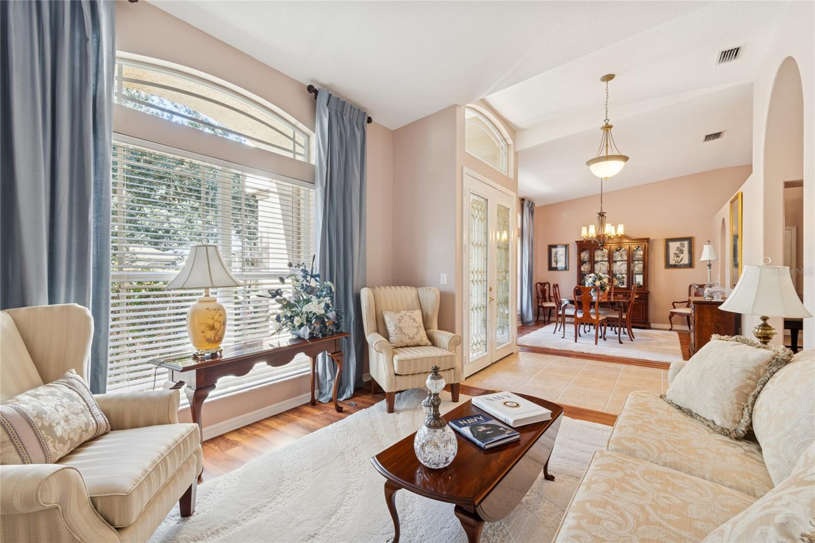 FORMAL LIVING ROOM WITH VIEW OF FOYER AND FORMAL DINING ROOM