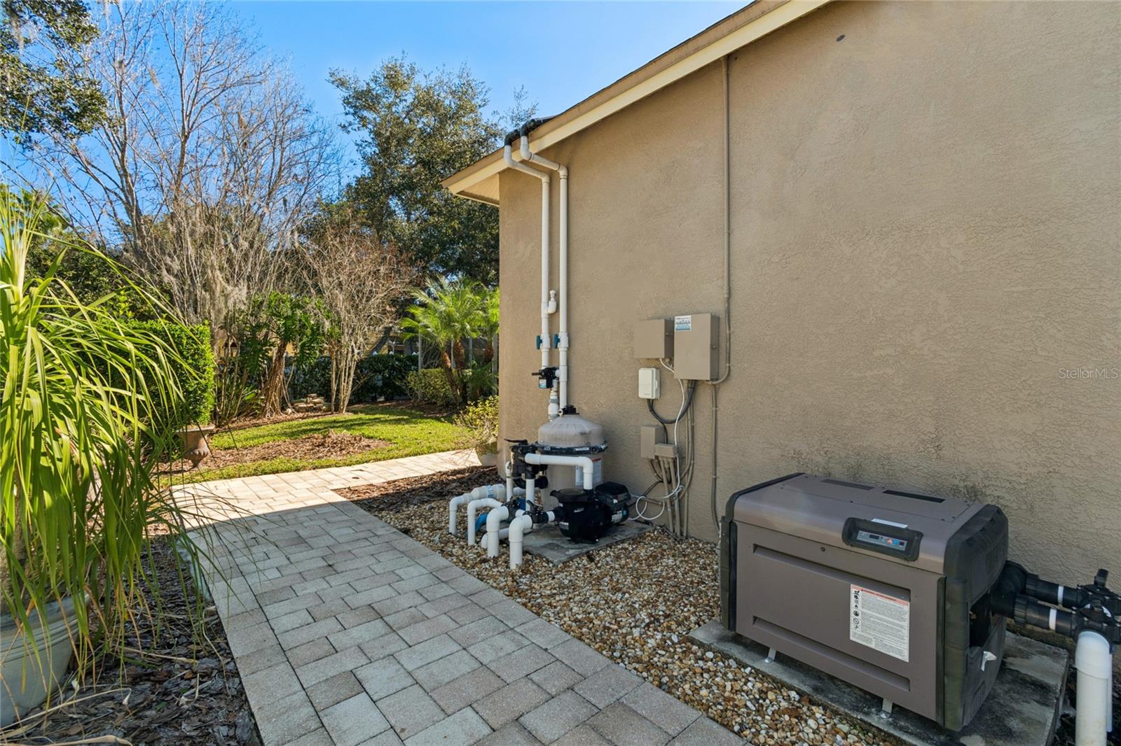 SIDE YARD VIEW OF POOL EQUIPMENT