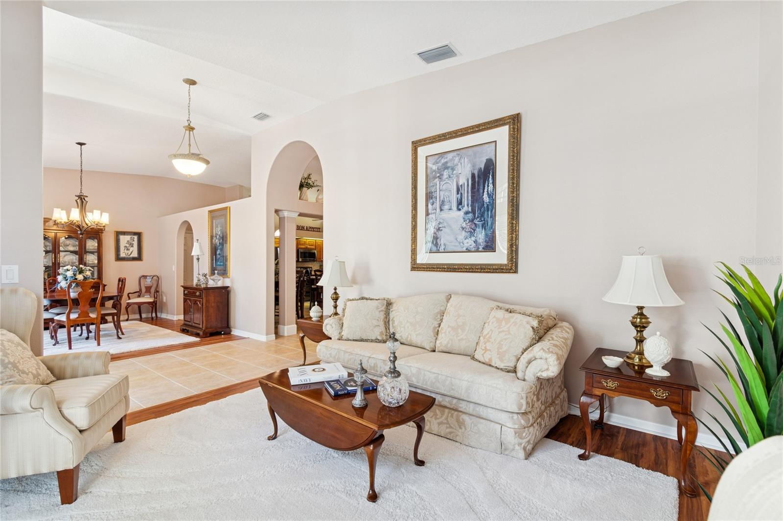 FORMAL LIVING ROOM WITH VIEW OF FOYER AND FORMAL DINING ROOM