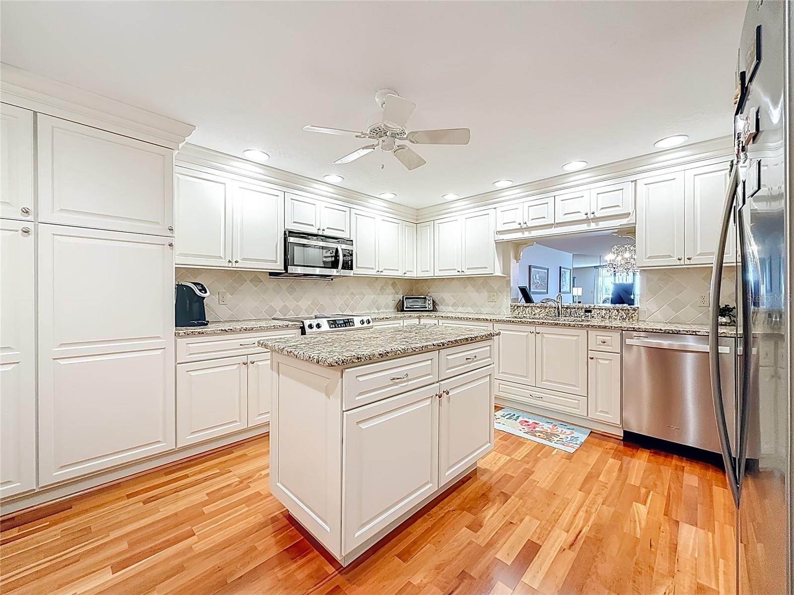 This picture offers a view of all of your upper cabinets that offer lots of storage space