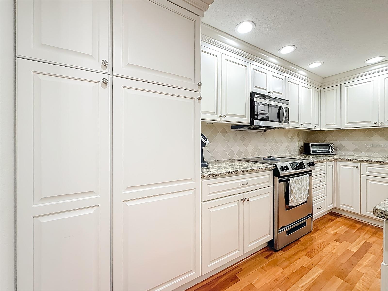 The kitchen has a closet pantry with pull outs.