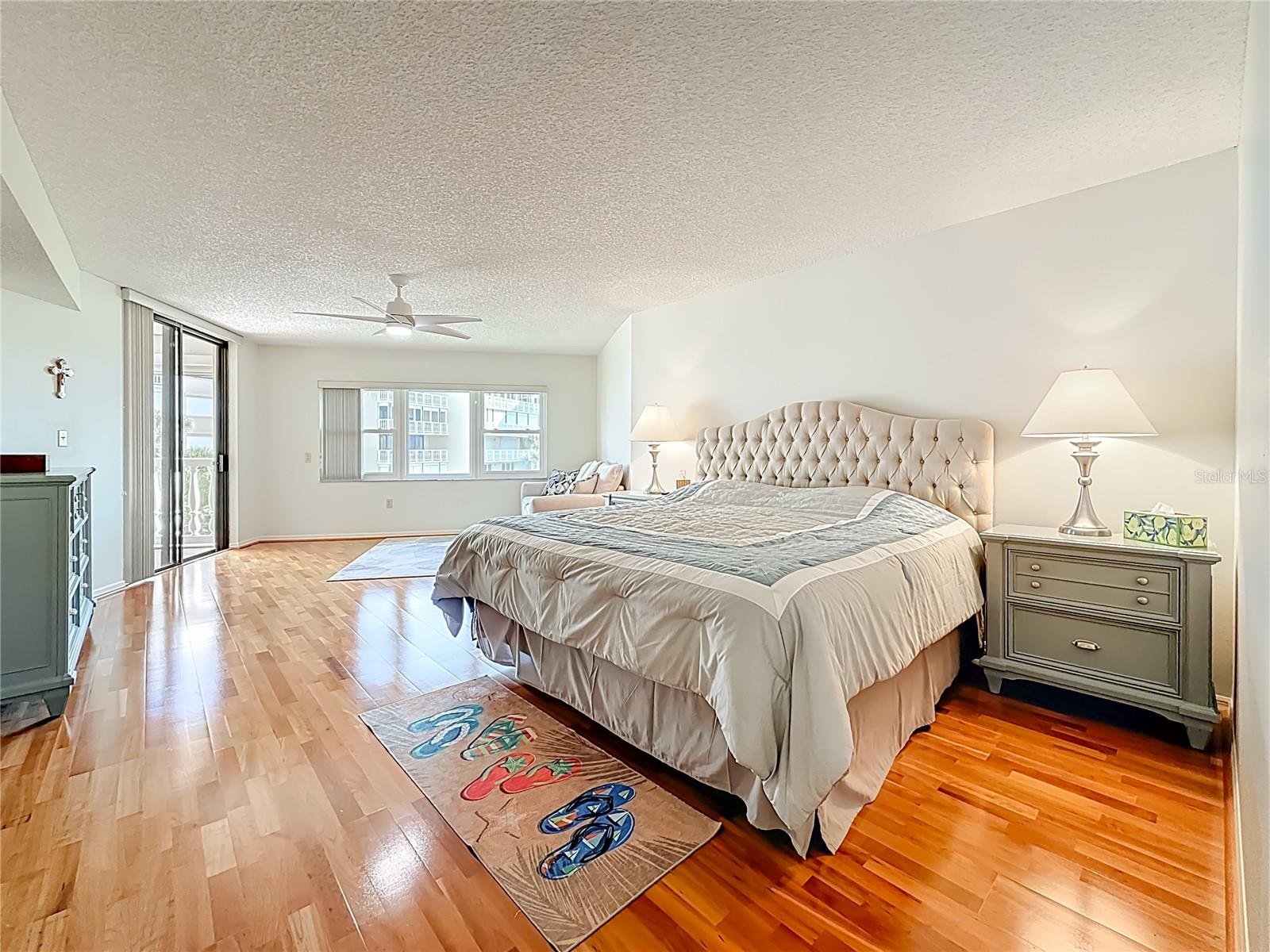 Primary bedroom suite that has sliders right out to the balcony