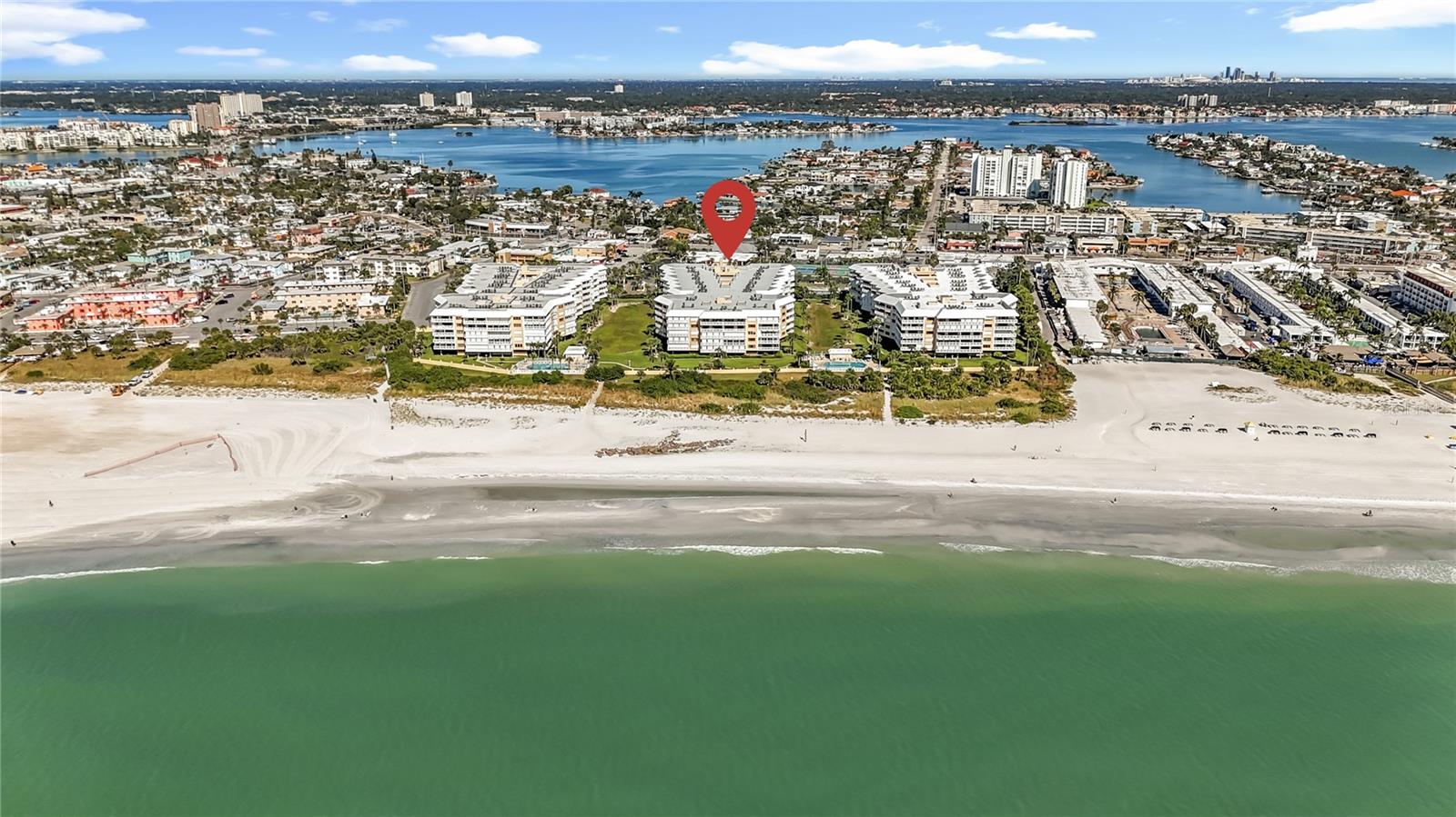 This aerial view shows the beautiful beach that is steps from your condo