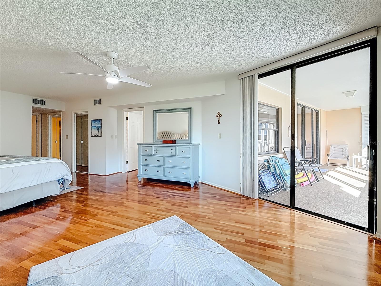 This view shows the sliders that lead out to the balcony from the primary bedroom