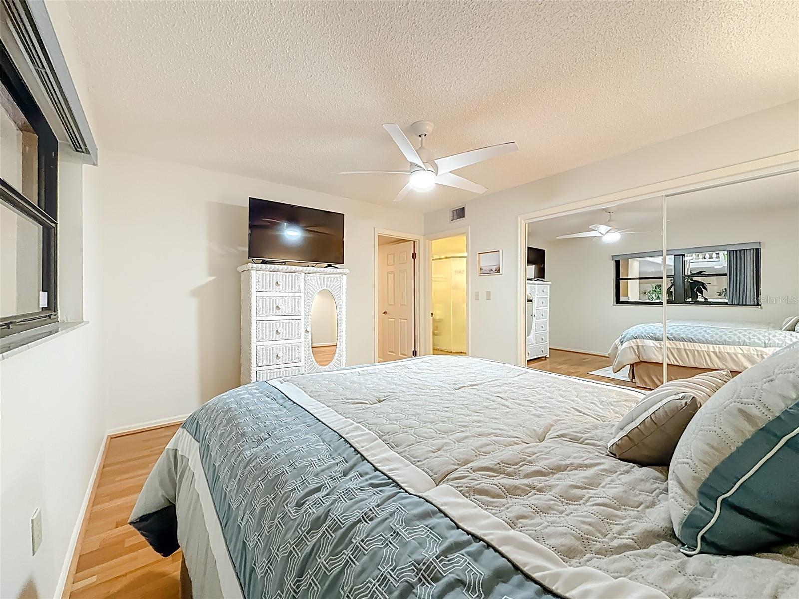Another view of the 2nd bedroom that is spacious and also has a wood floor