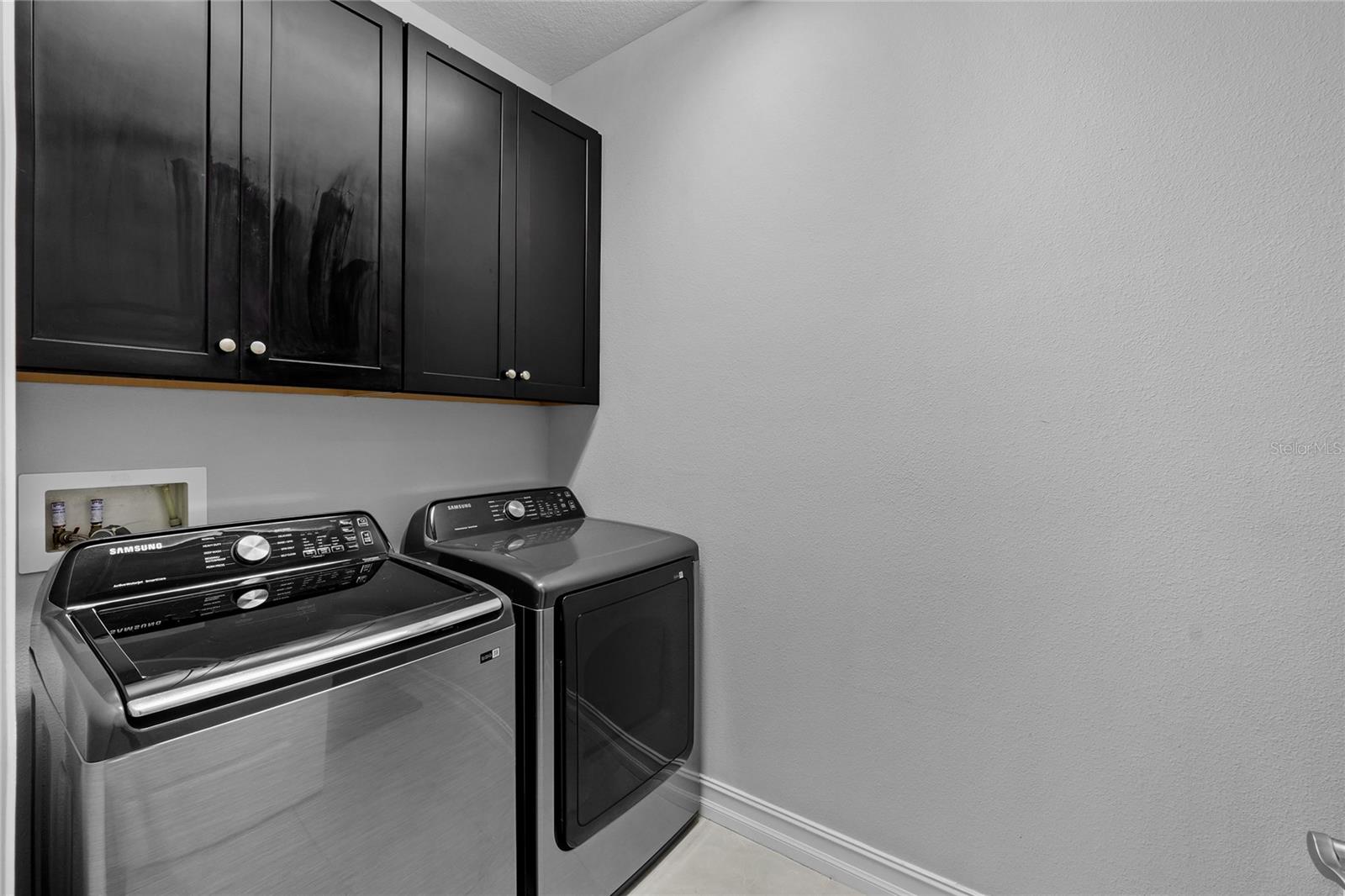 Laundry Room with Espresso Cabinets