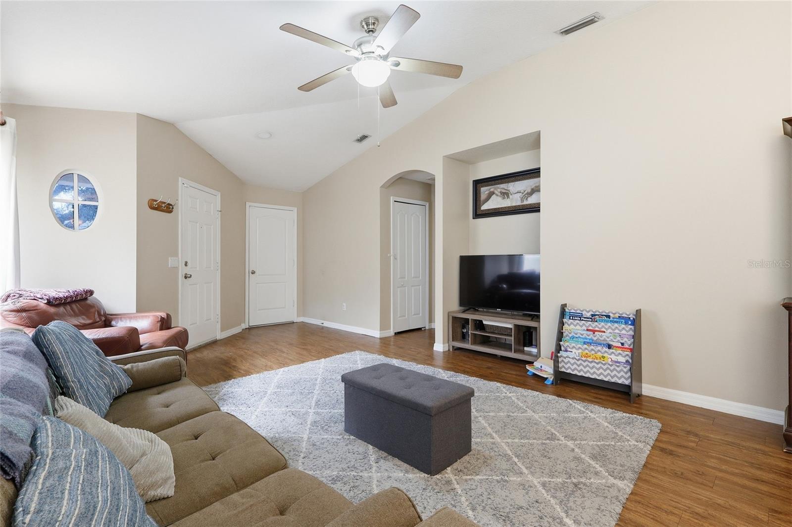 Living room glancing back toward the fron door.