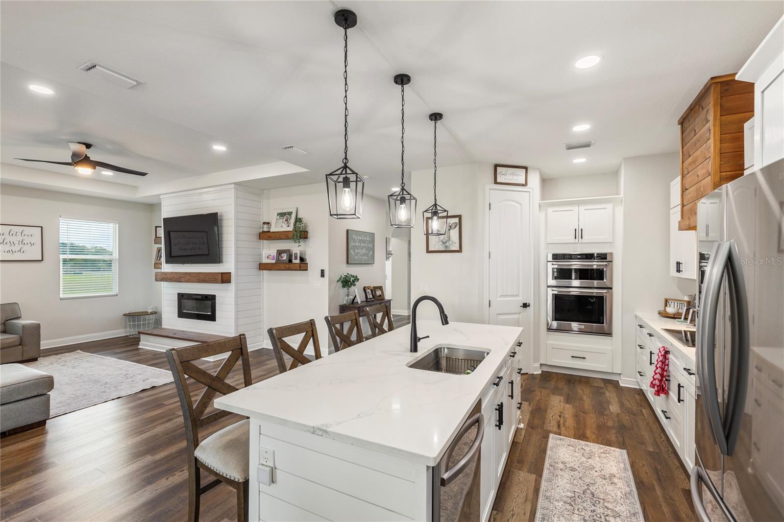 Kitchen with built in double oven with microwave capability