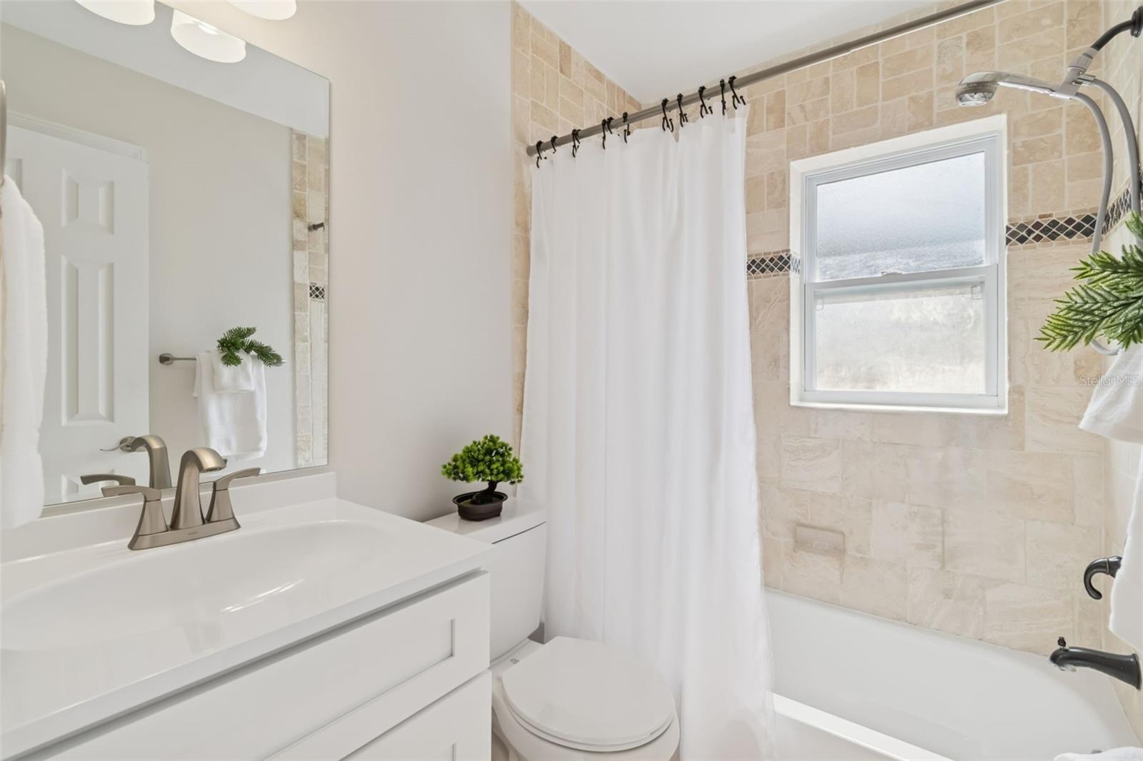 The lovely 2nd bath is conveniently located adjacent to the 2nd and 3rd bedrooms.