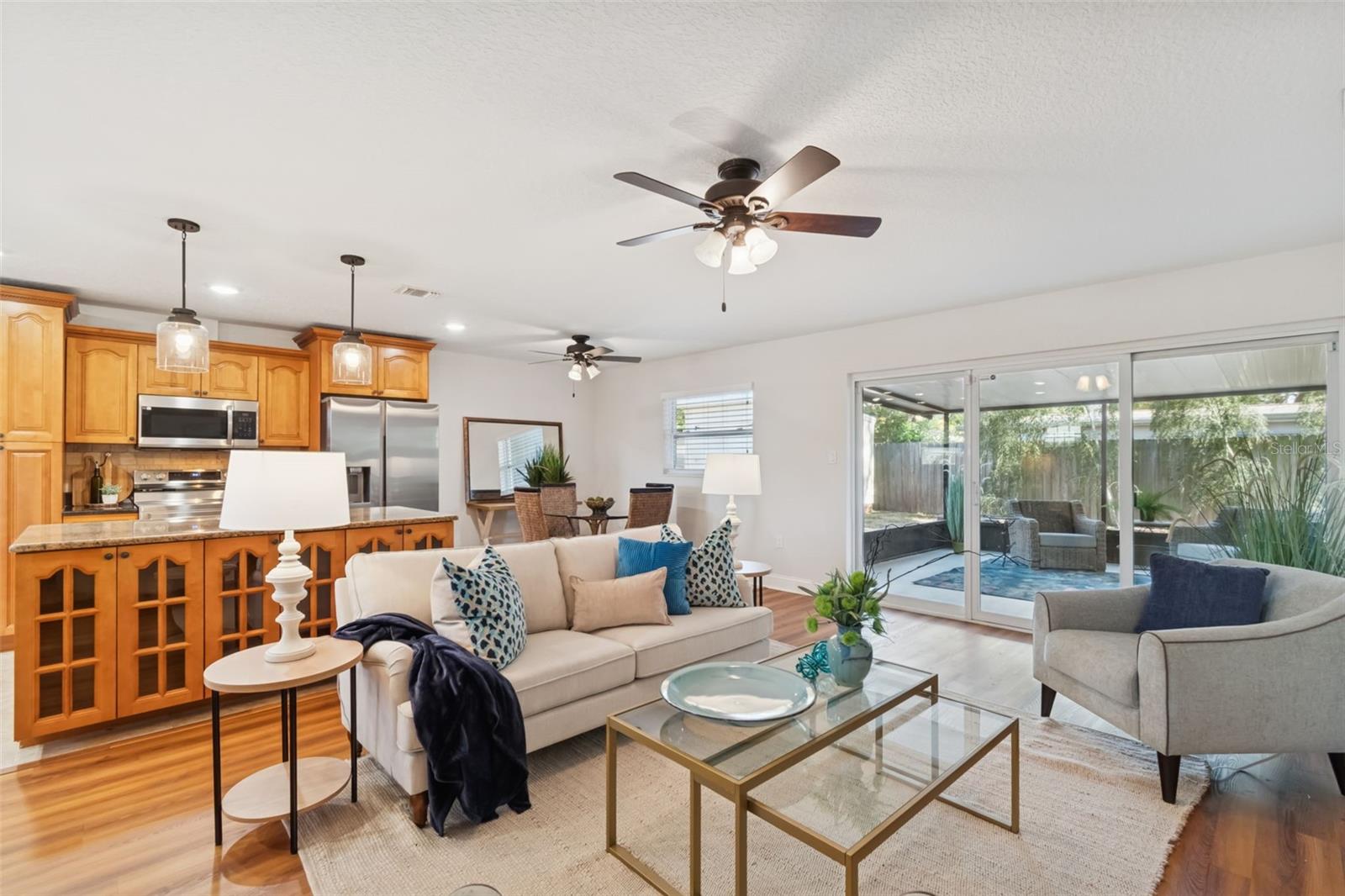 The open concept floorplan is perfect for friends and family gatherings and the huge covered patio is ready for those BBQ's!