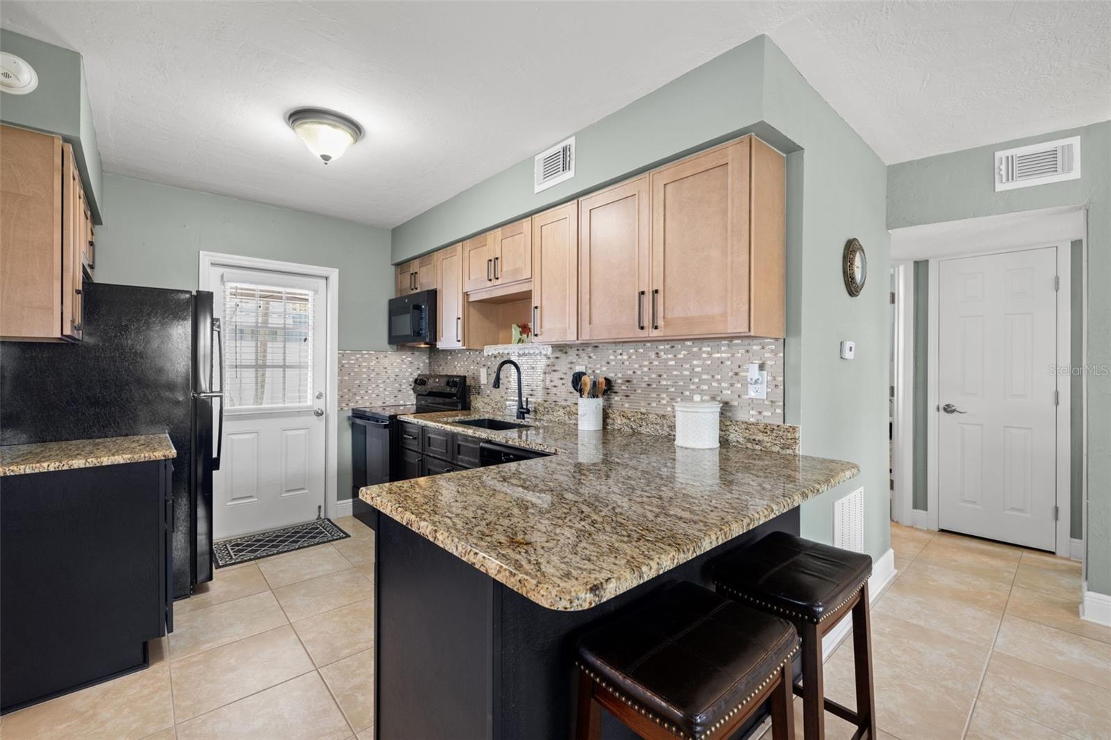 Bright kitchen with island seating