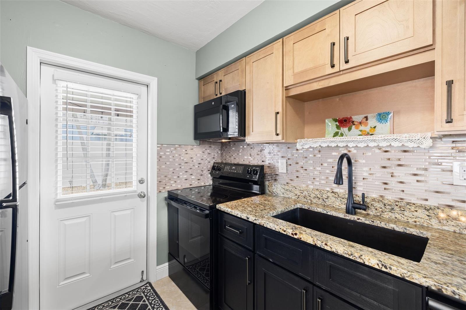 Fresh cabinetry and modern backsplash