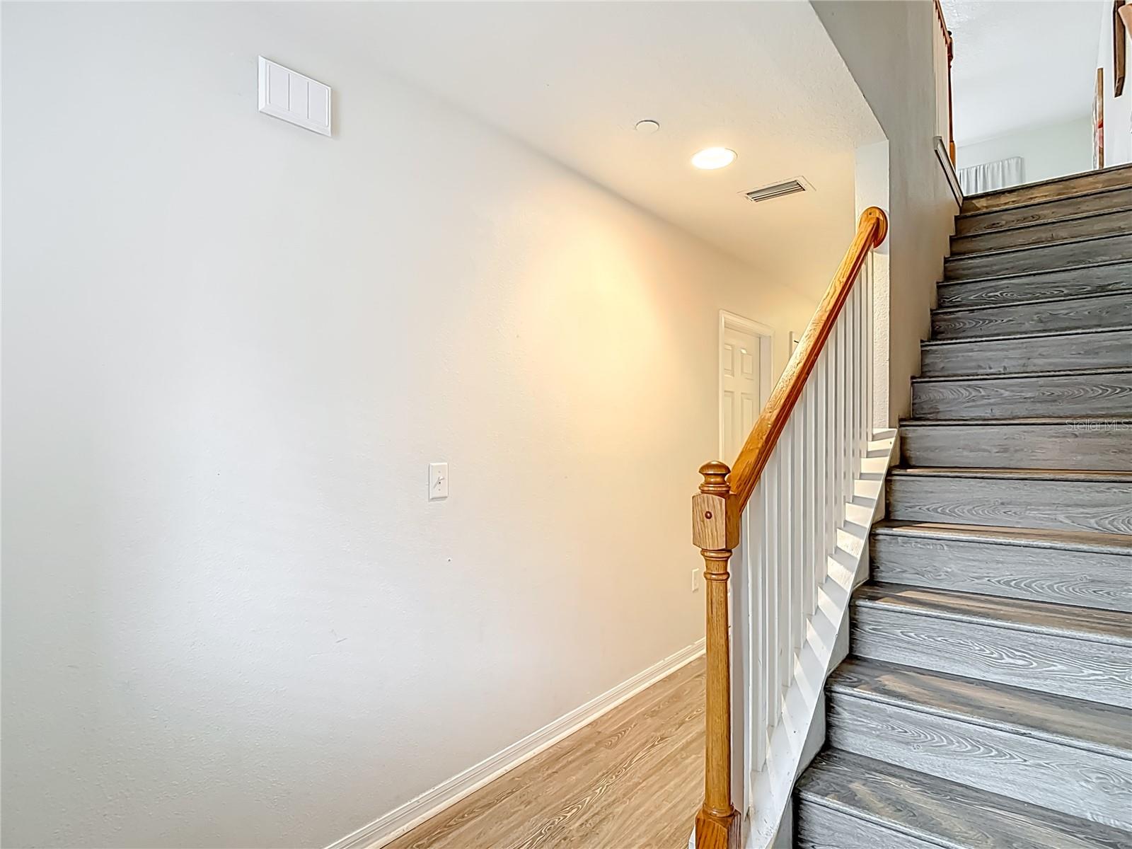 Stairs from Entry, Left to 1st Bedroom.