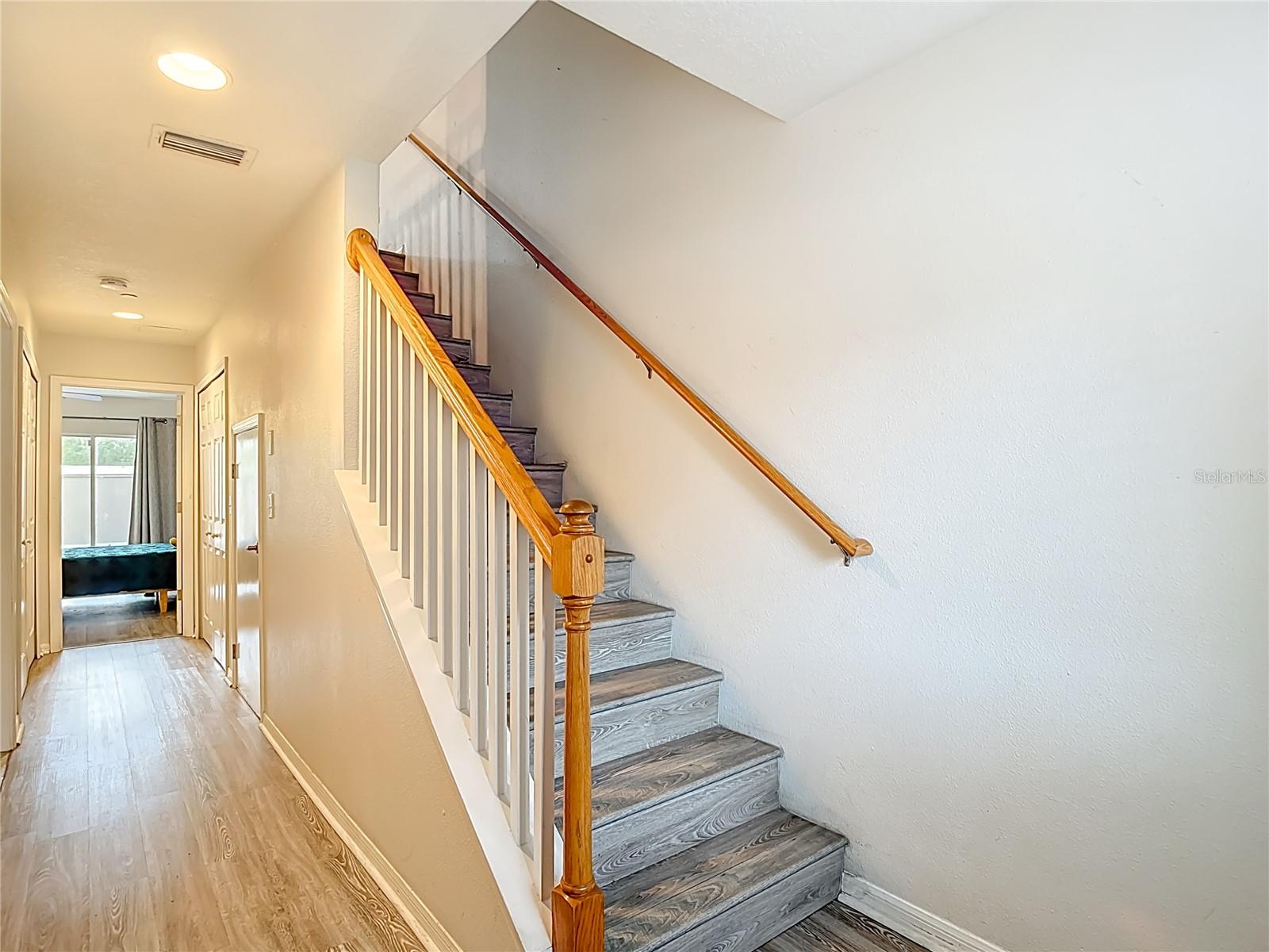 Stairs to Main Level, Hall to First Floor Bedroom or Flex Area.