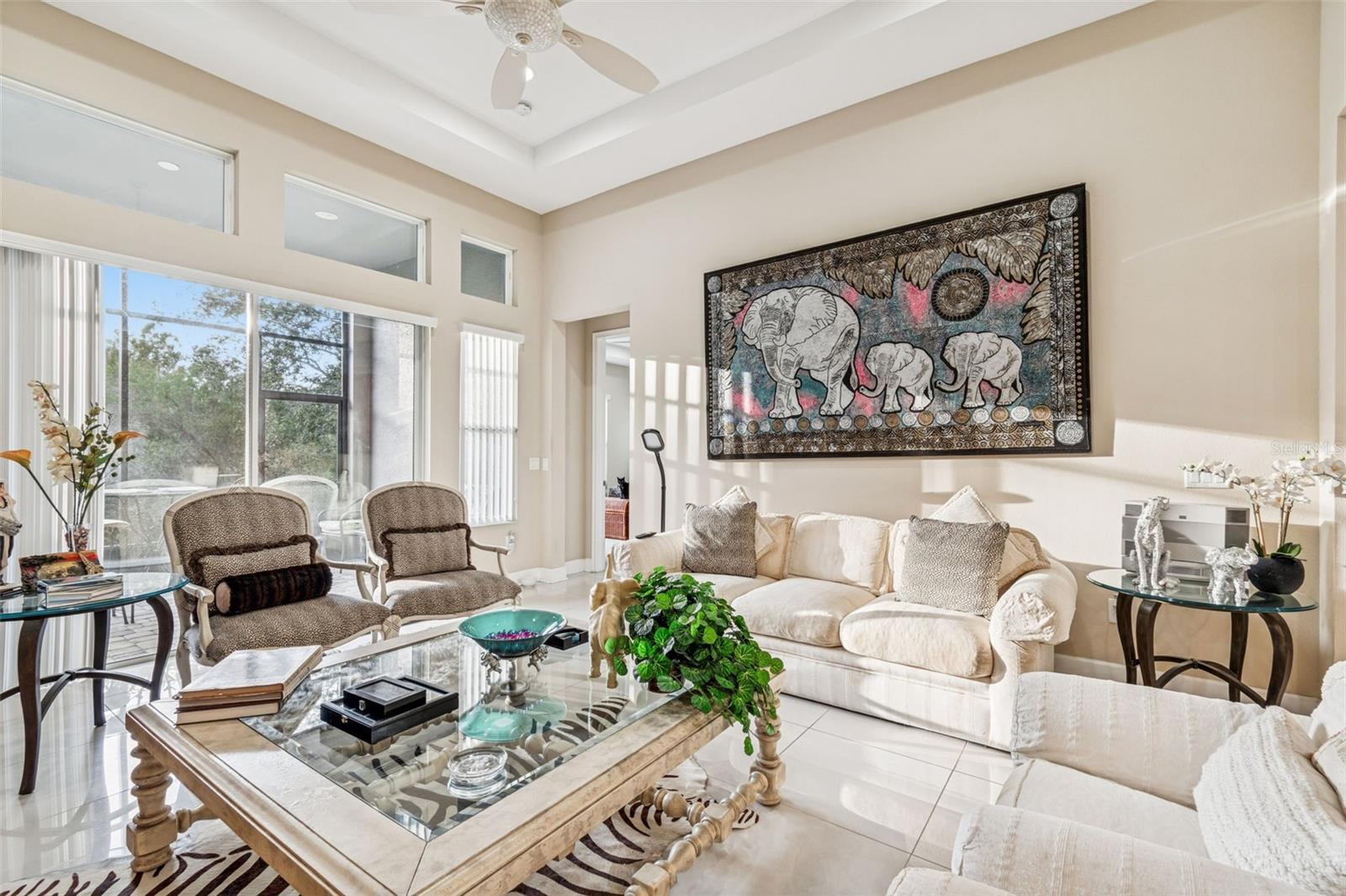 Light-filled living room with soaring ceilings and seamless flow to the kitchen