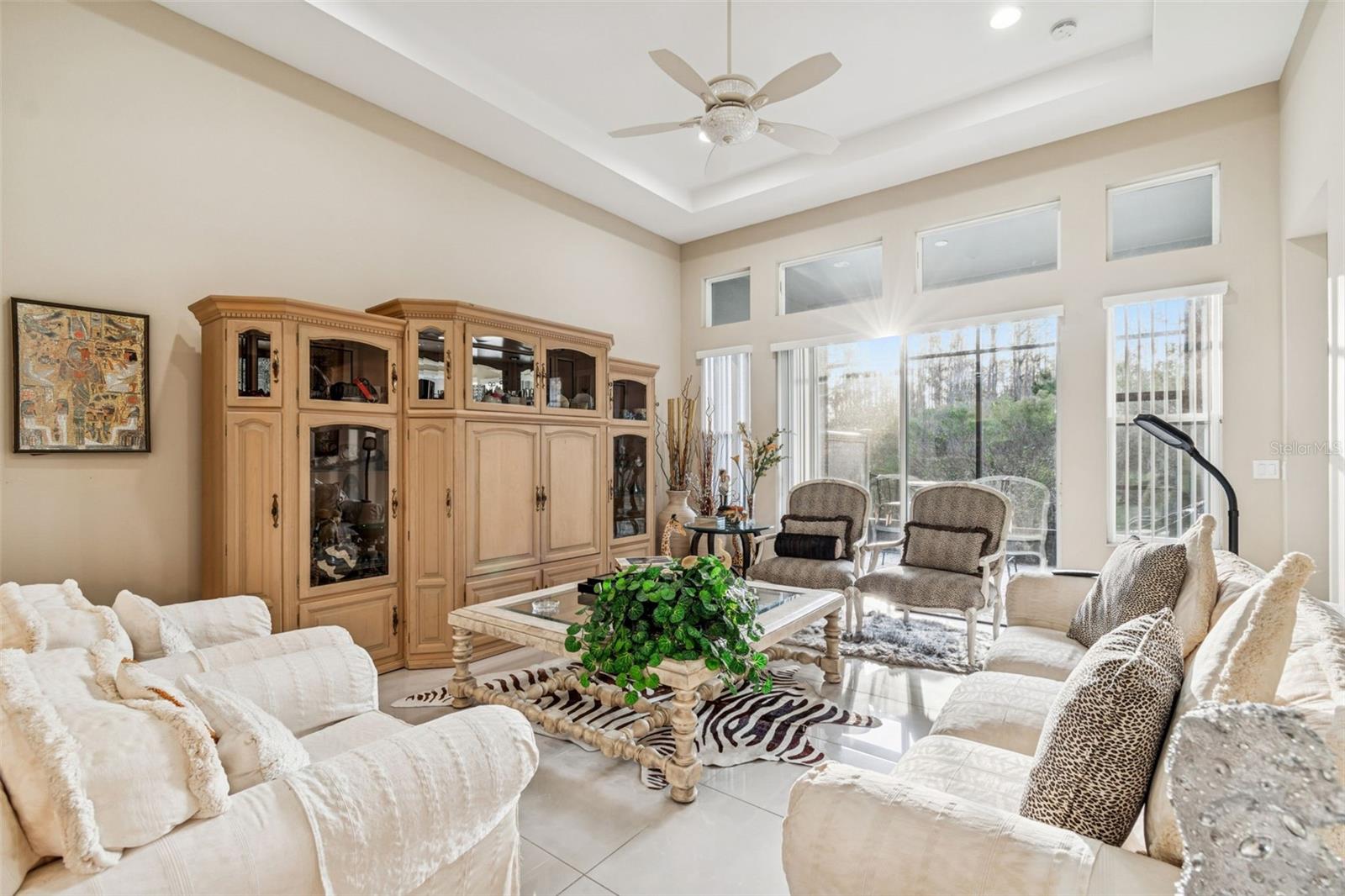Light-filled living room with soaring ceilings and seamless flow to the kitchen