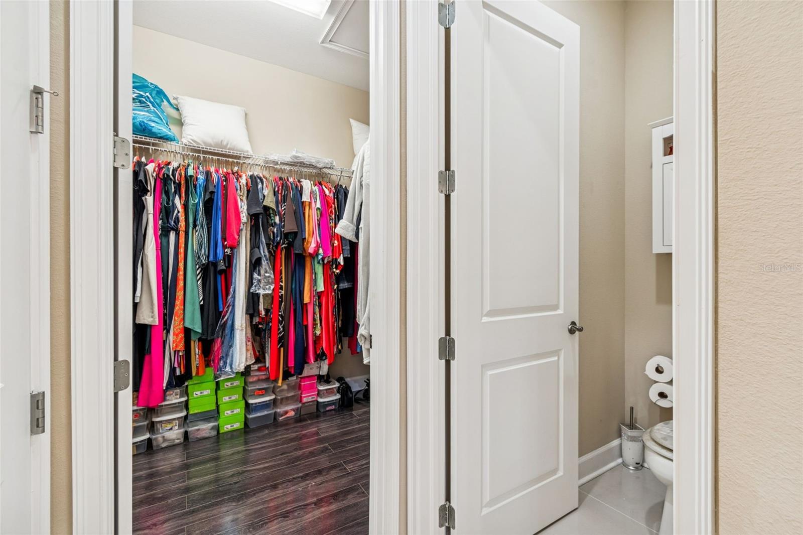 Primary ensuite with oversized walk-in closet and separate water room