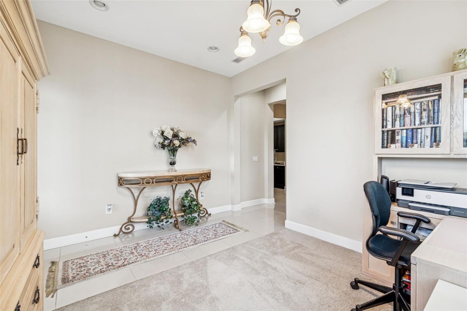 Flexible front room perfect for a home office or sitting area