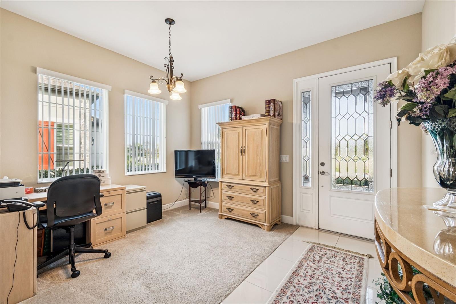 Flexible front room perfect for a home office or sitting area