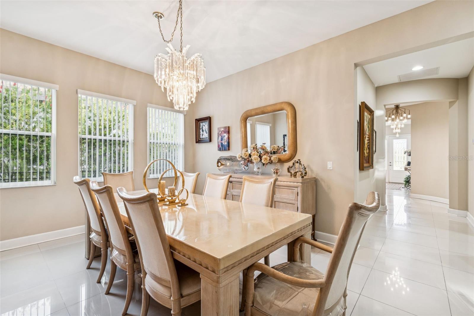 Light-filled dining room with statement chandelier