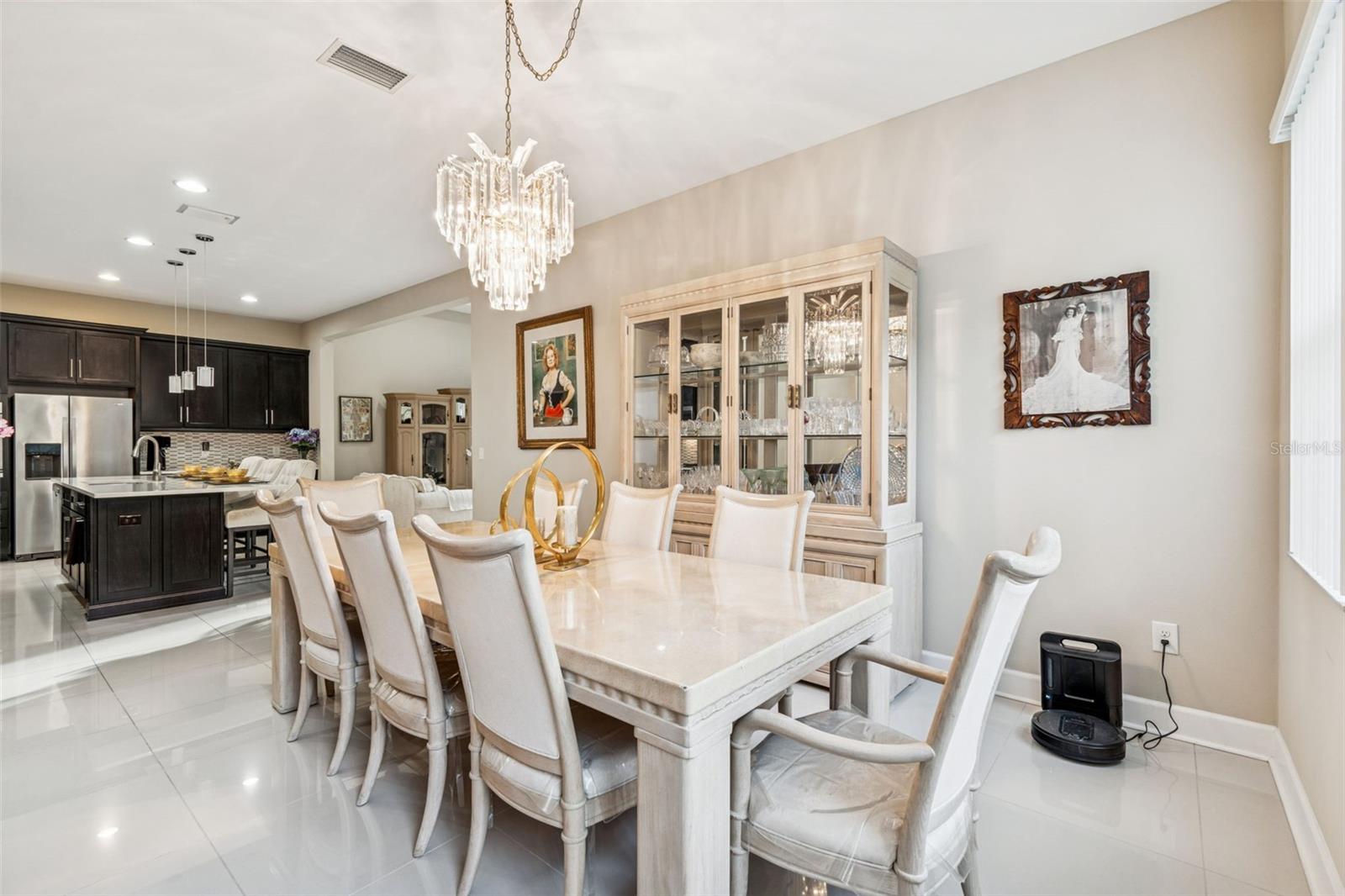 Light-filled dining room with statement chandelier