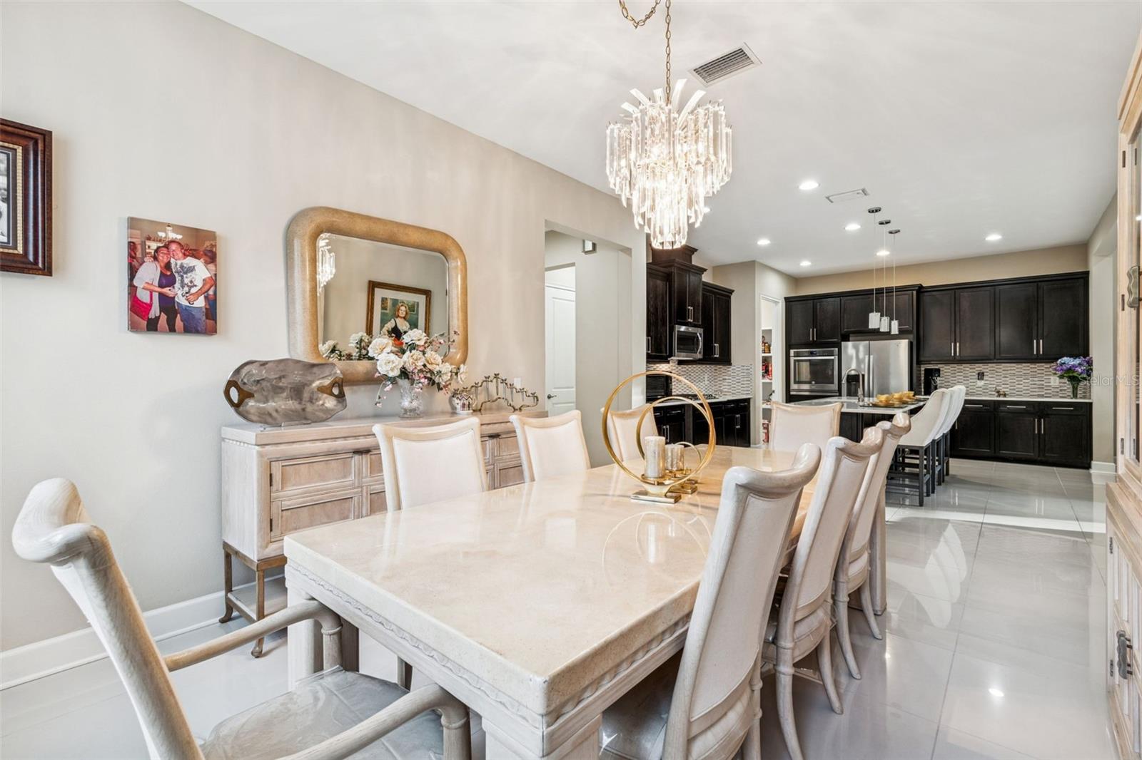Light-filled dining room with statement chandelier