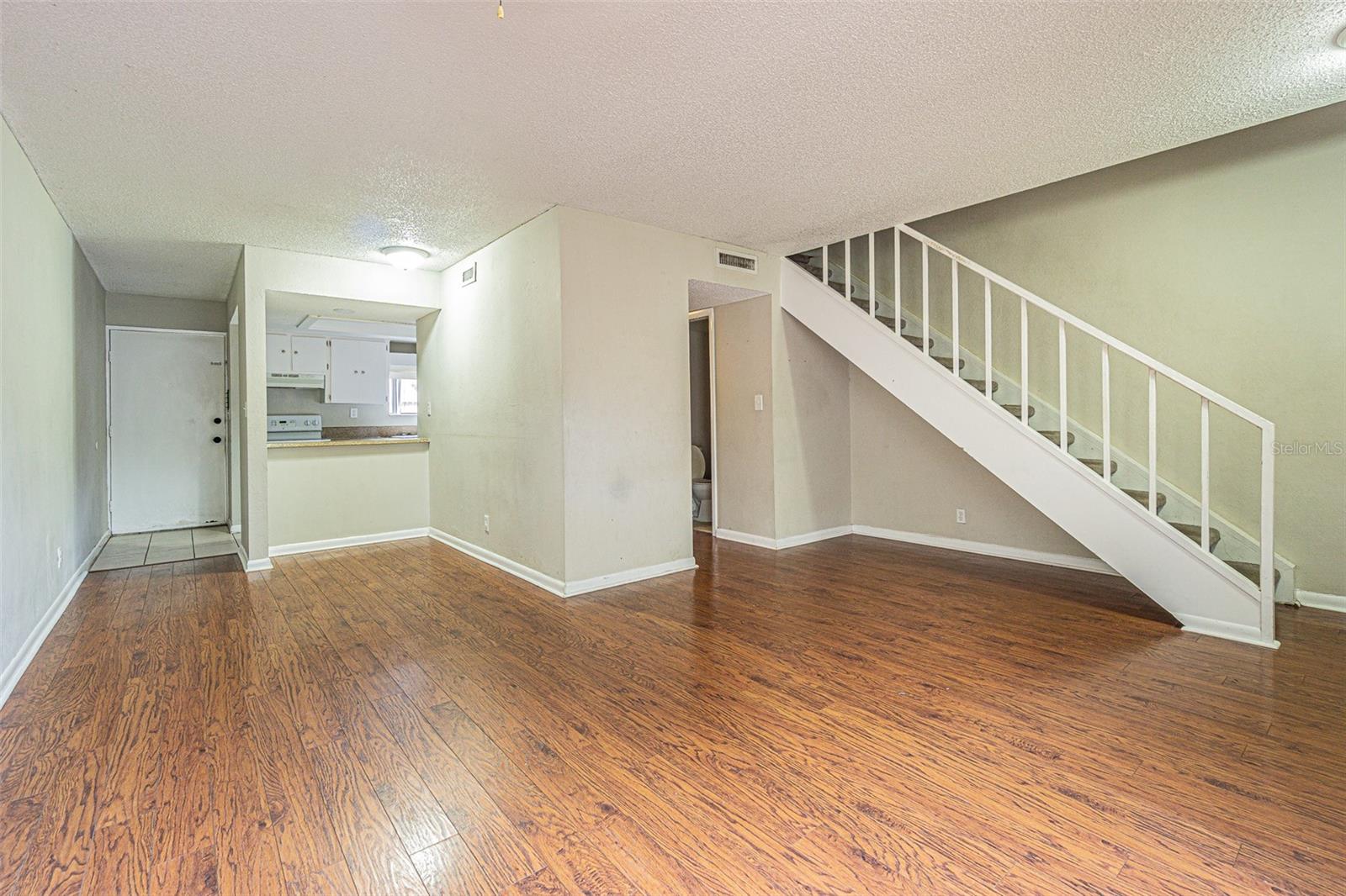 Living/dining back to kitchen and entry door