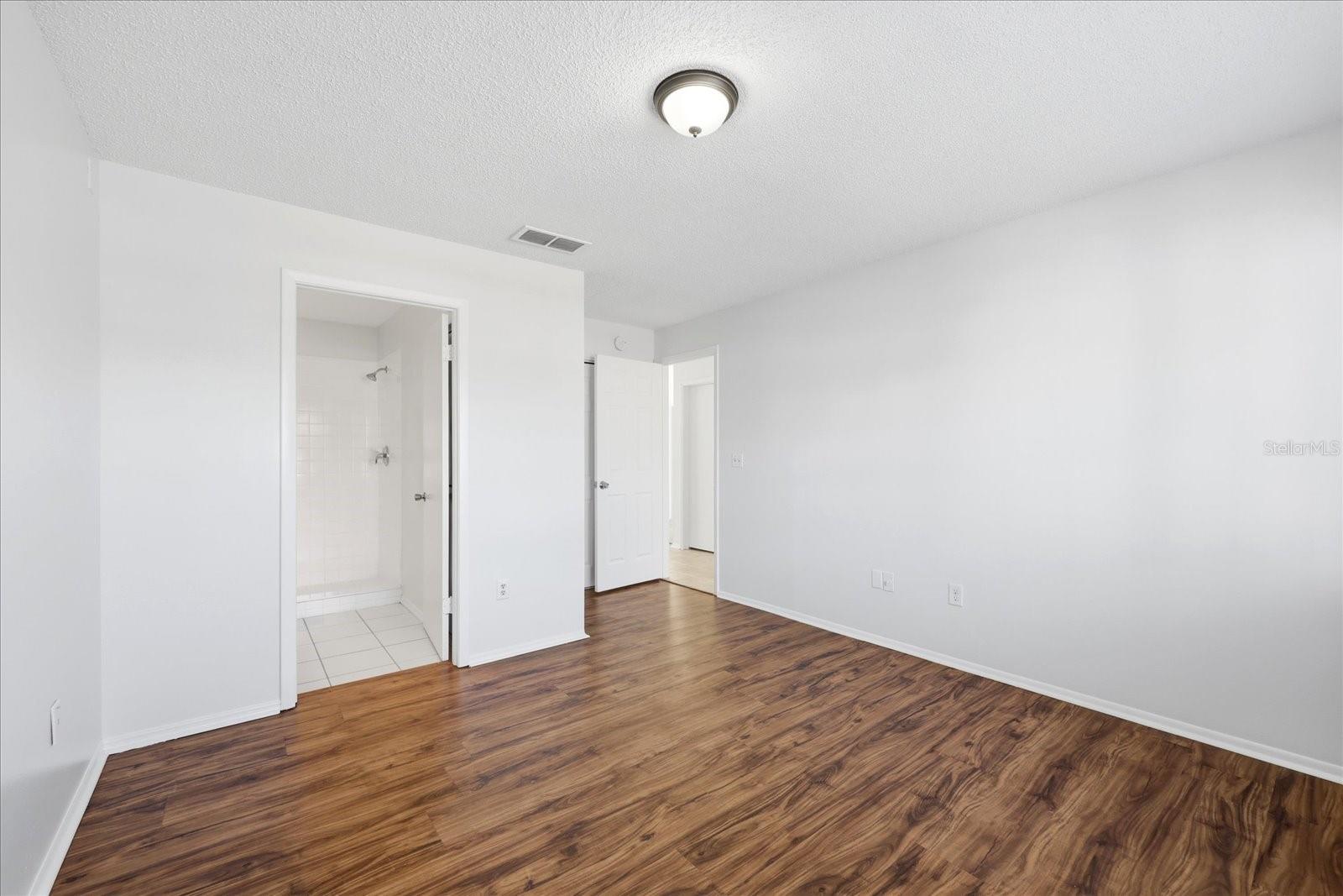 Primary Bedroom with En Suite bathroom and walk in closet.