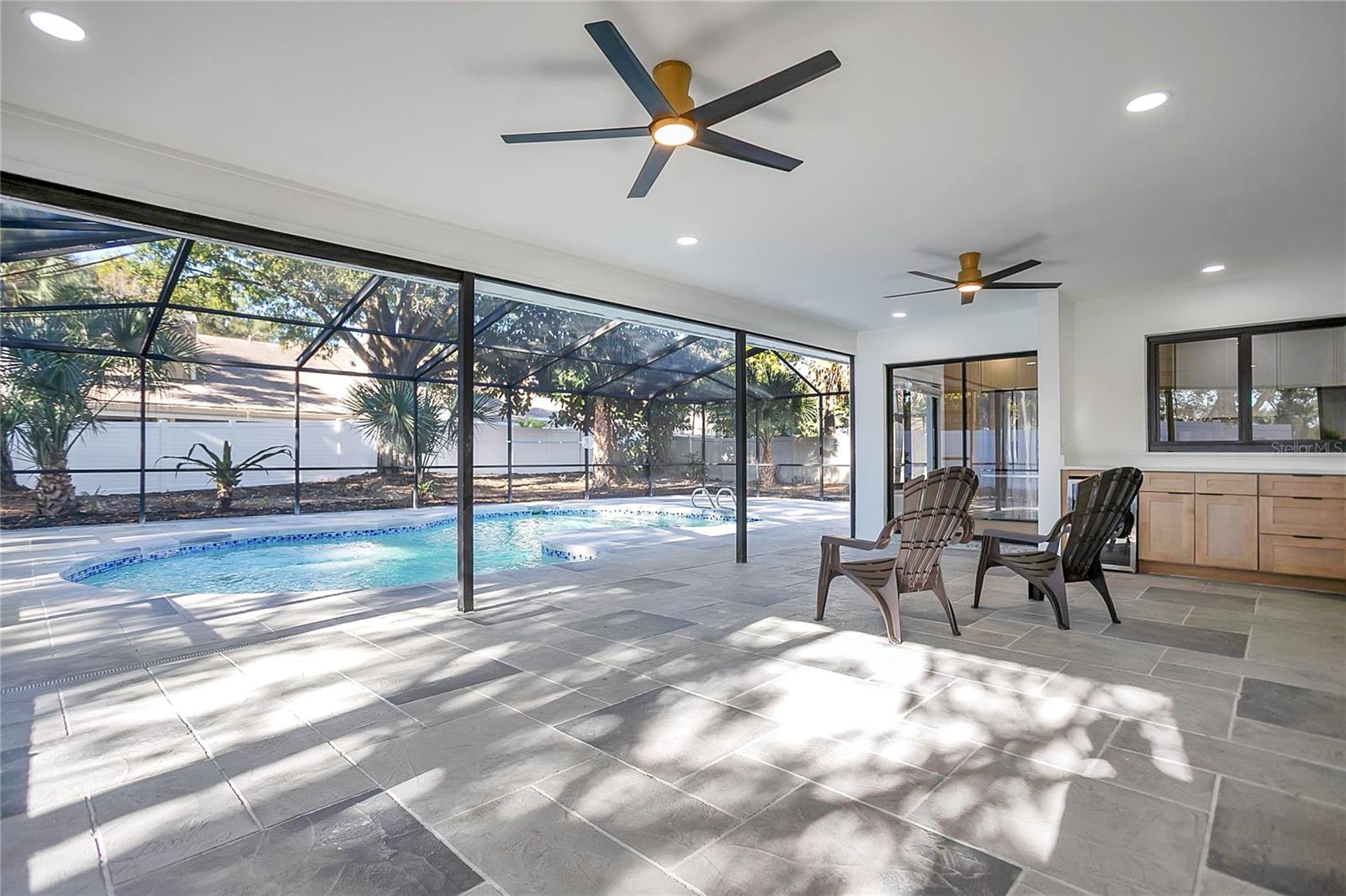 Expansive screened in Pool and patio, perfect for gatherings and enjoying indoor-outdoor living