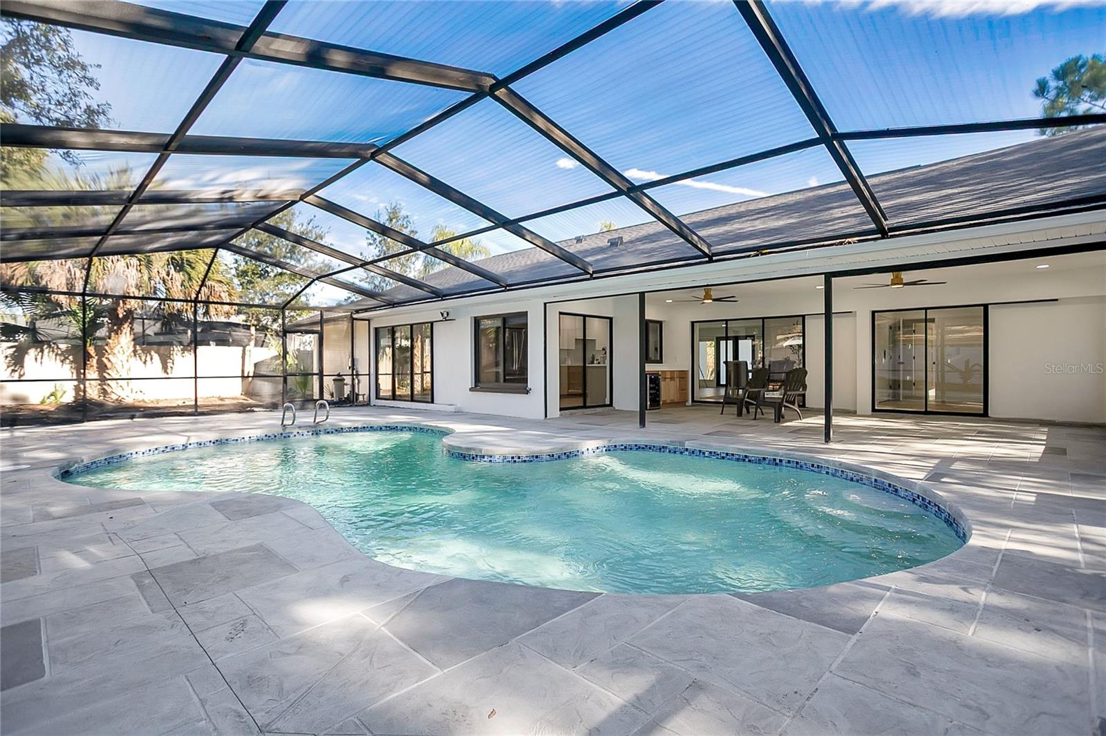 Expansive screened in Pool and patio, perfect for gatherings and enjoying indoor-outdoor living