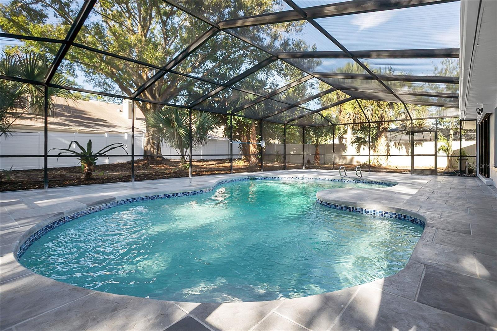 Expansive screened in Pool and patio, perfect for gatherings and enjoying indoor-outdoor living